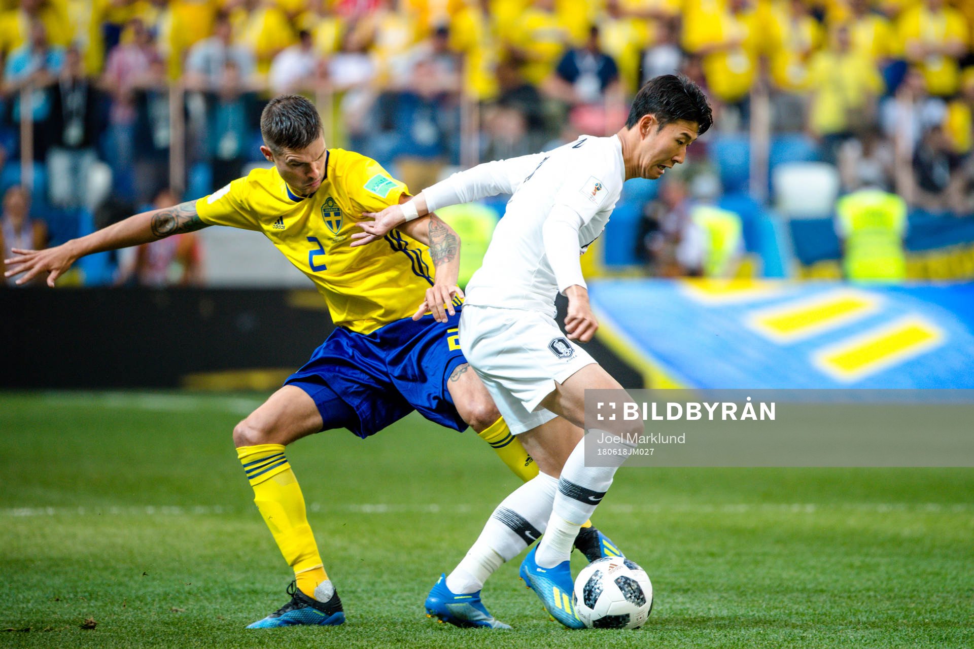 Mikael Lustig of Sweden and Heungmin Son of South Korea