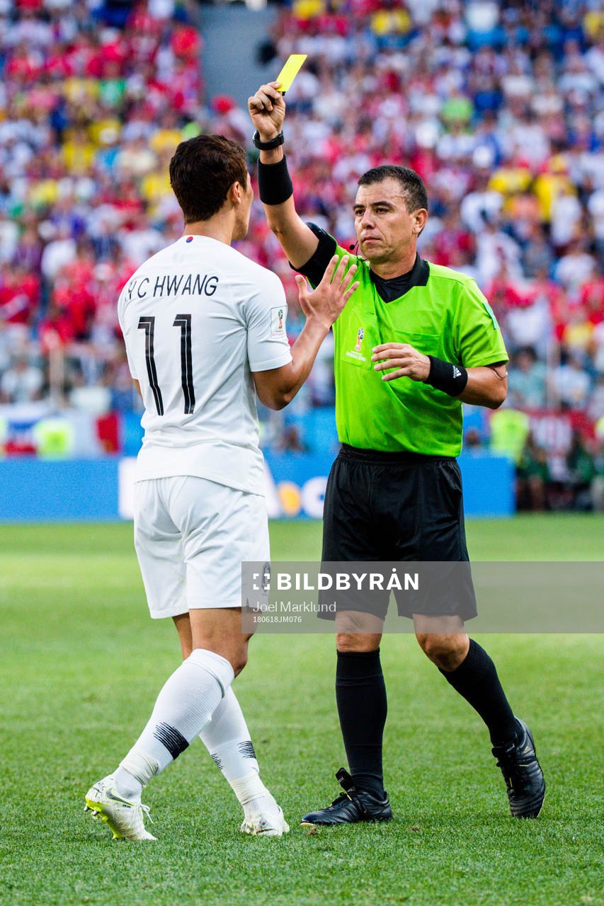 Heechan Hwang of South Korea and Referee Joel Aguilar