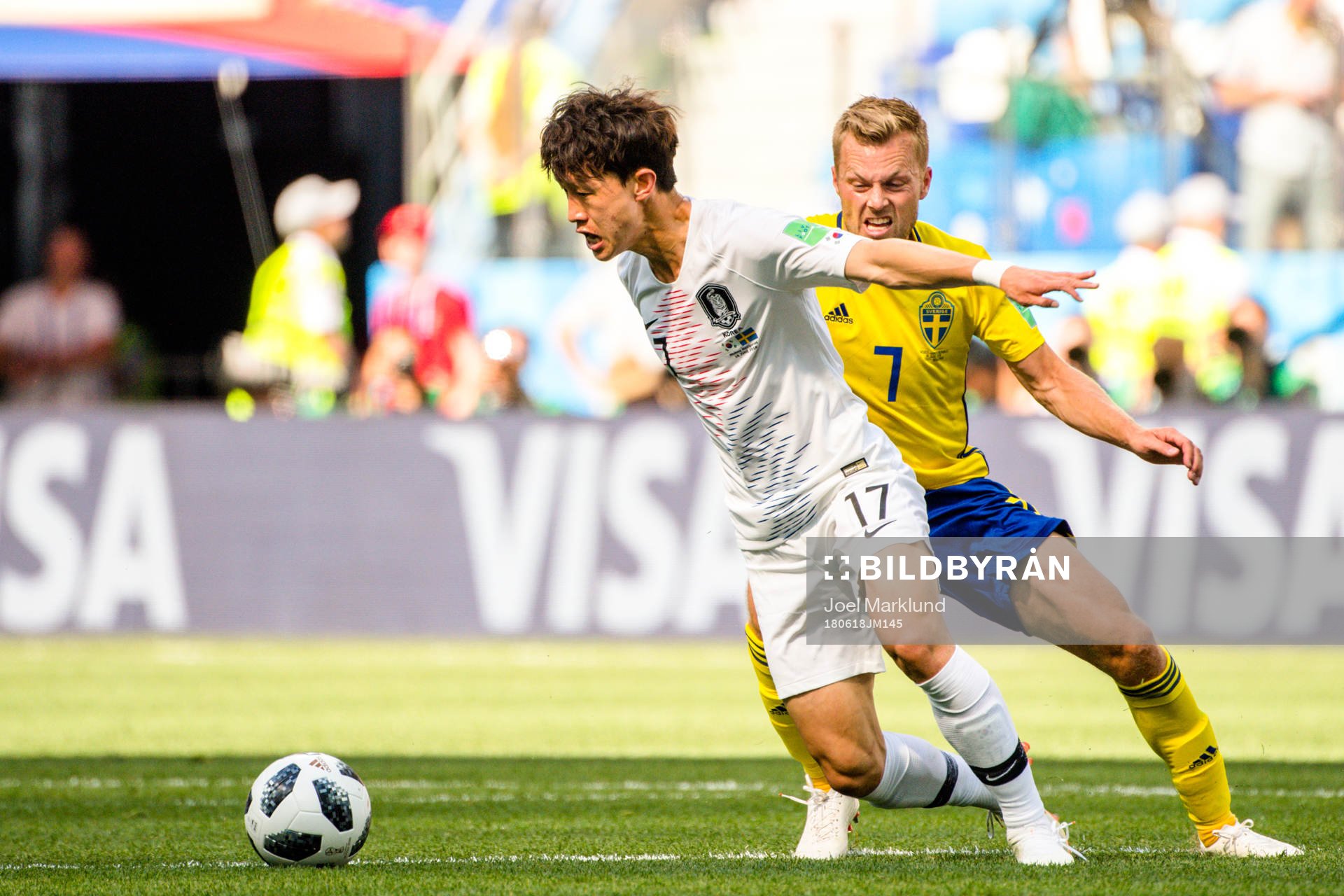 Jaesung Lee of South Korea and Sebastian Larsson of Sweden