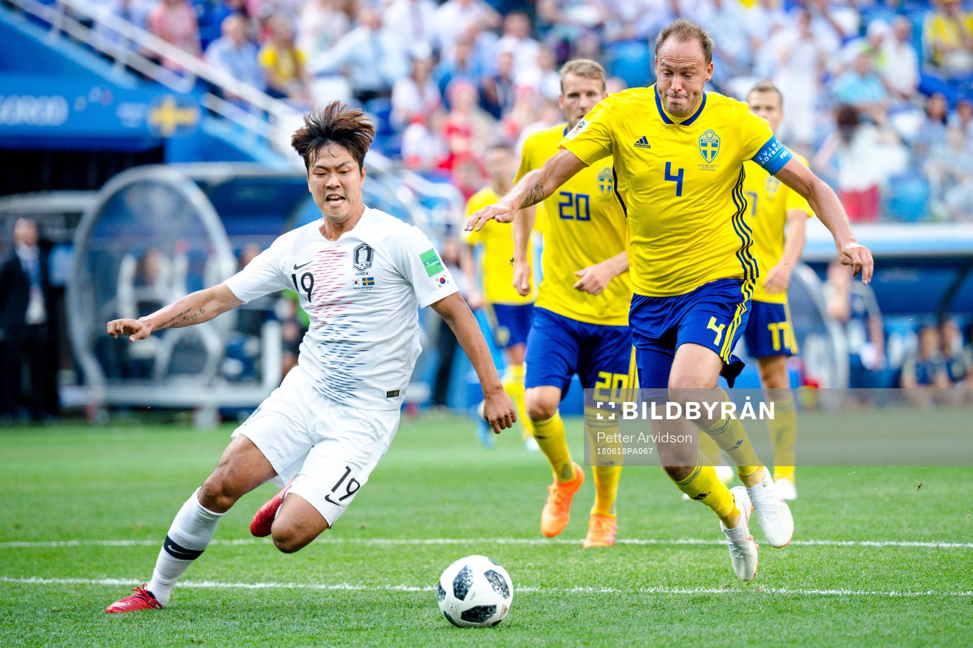 Younggwon Kim of South Korea and Andreas Granqvist of Sweden