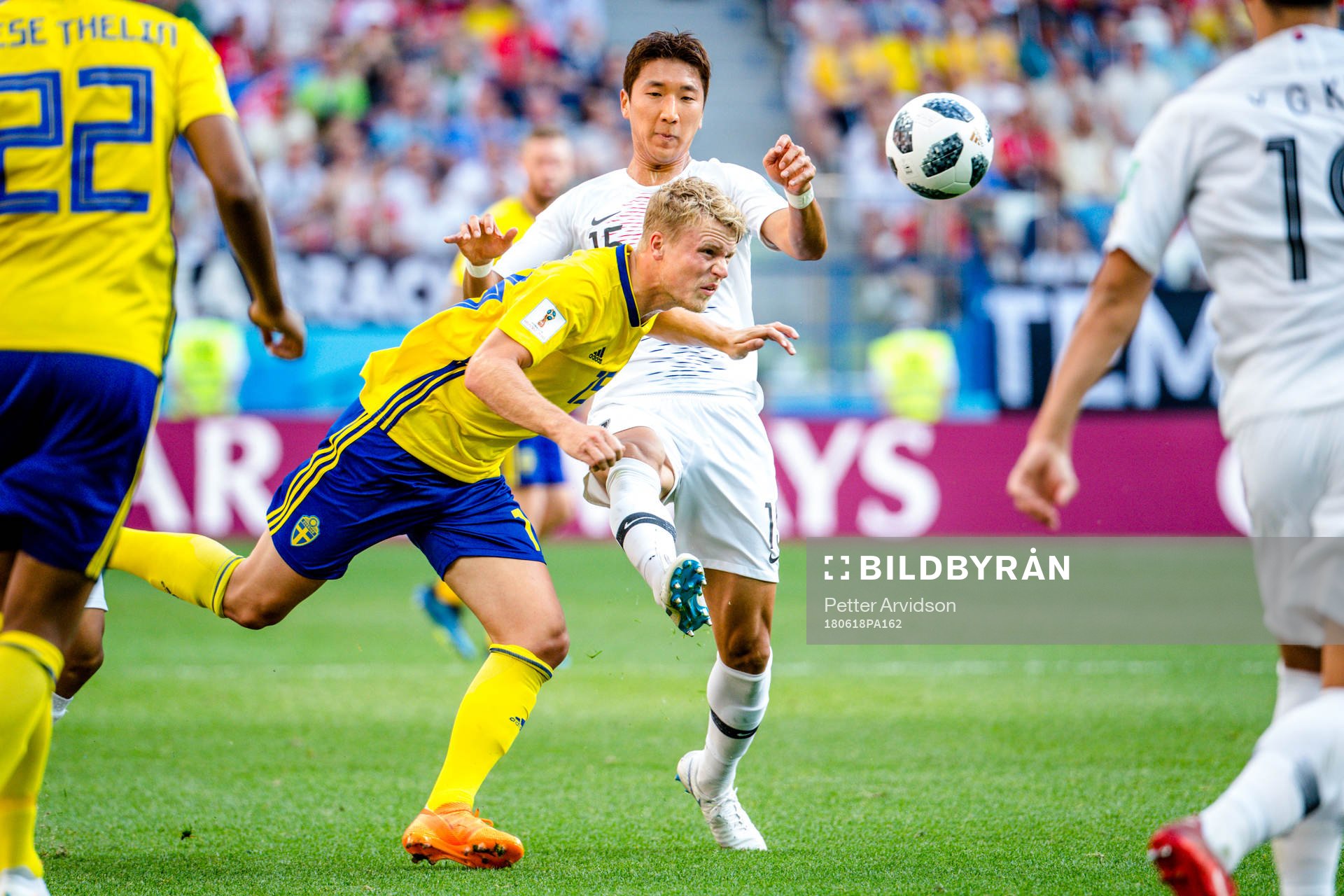 Oscar Hiljemark of Sweden and Wooyoung Jung of South Korea