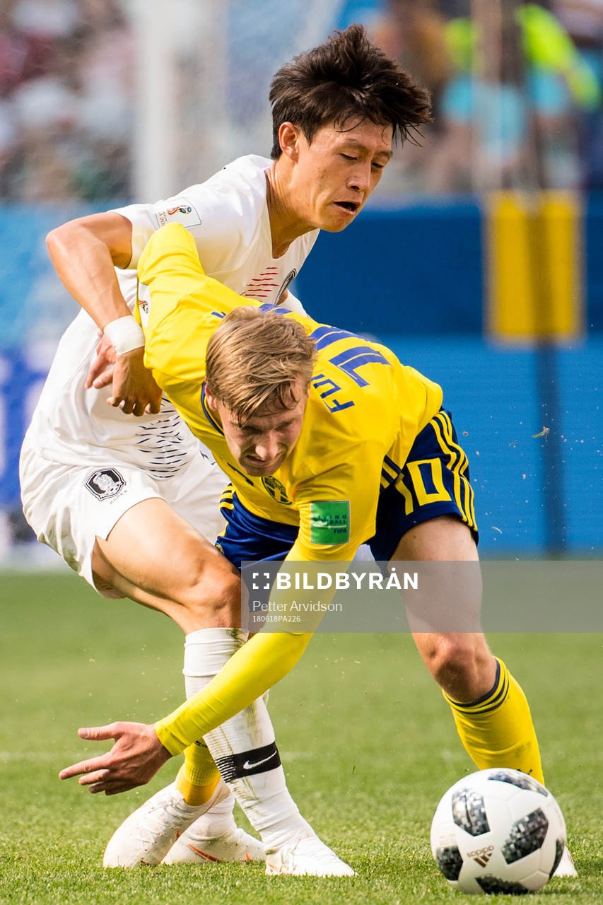Emil Forsberg of Sweden and Jaesung Lee of South Korea