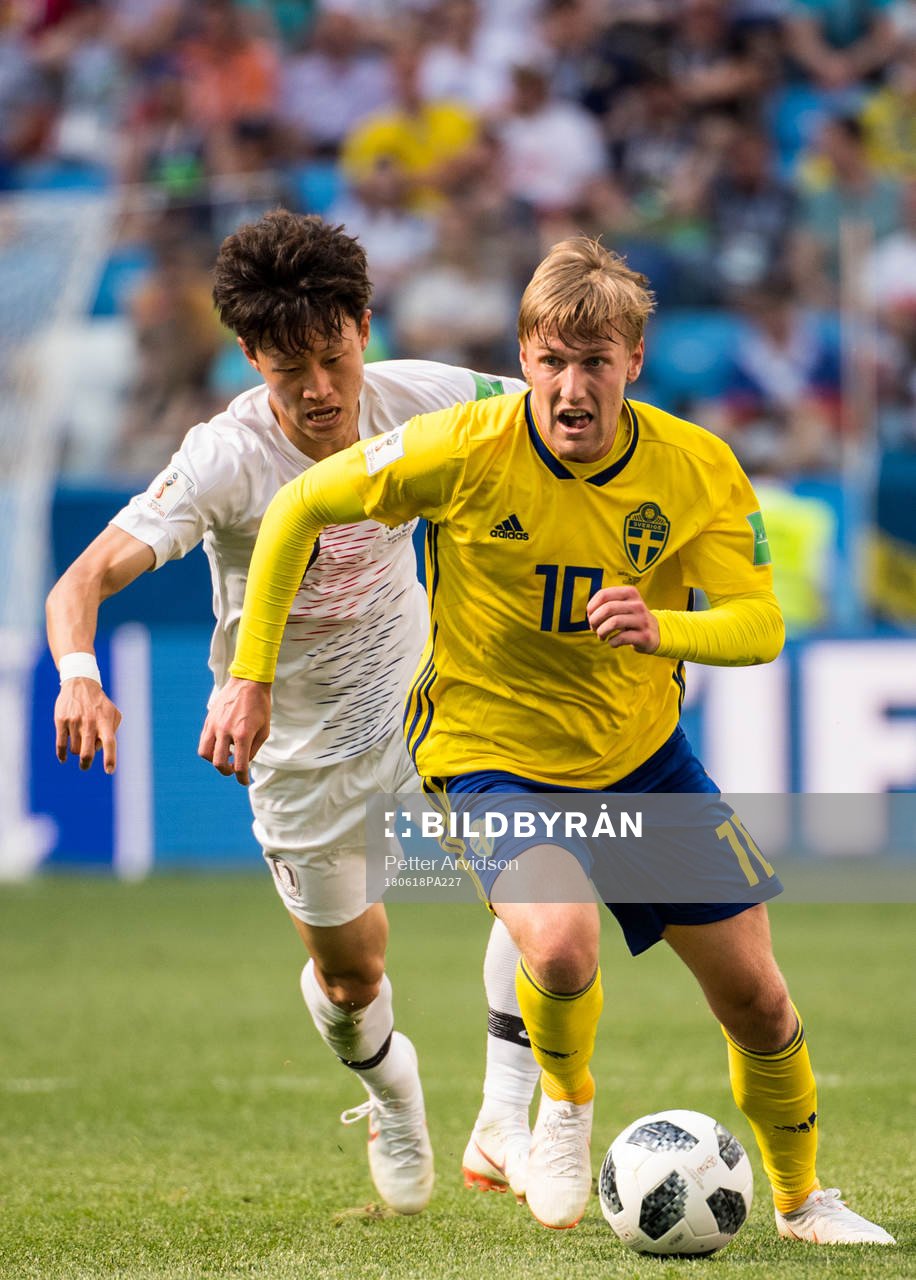 Emil Forsberg of Sweden and Jaesung Lee of South Korea