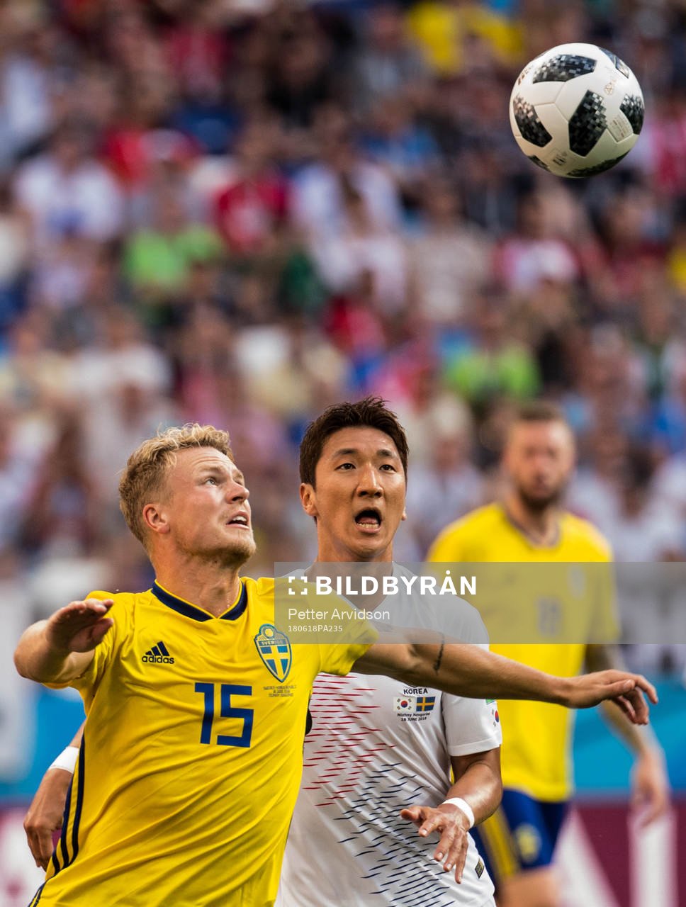 Oscar Hiljemark of Sweden and Wooyoung Jung of South Korea