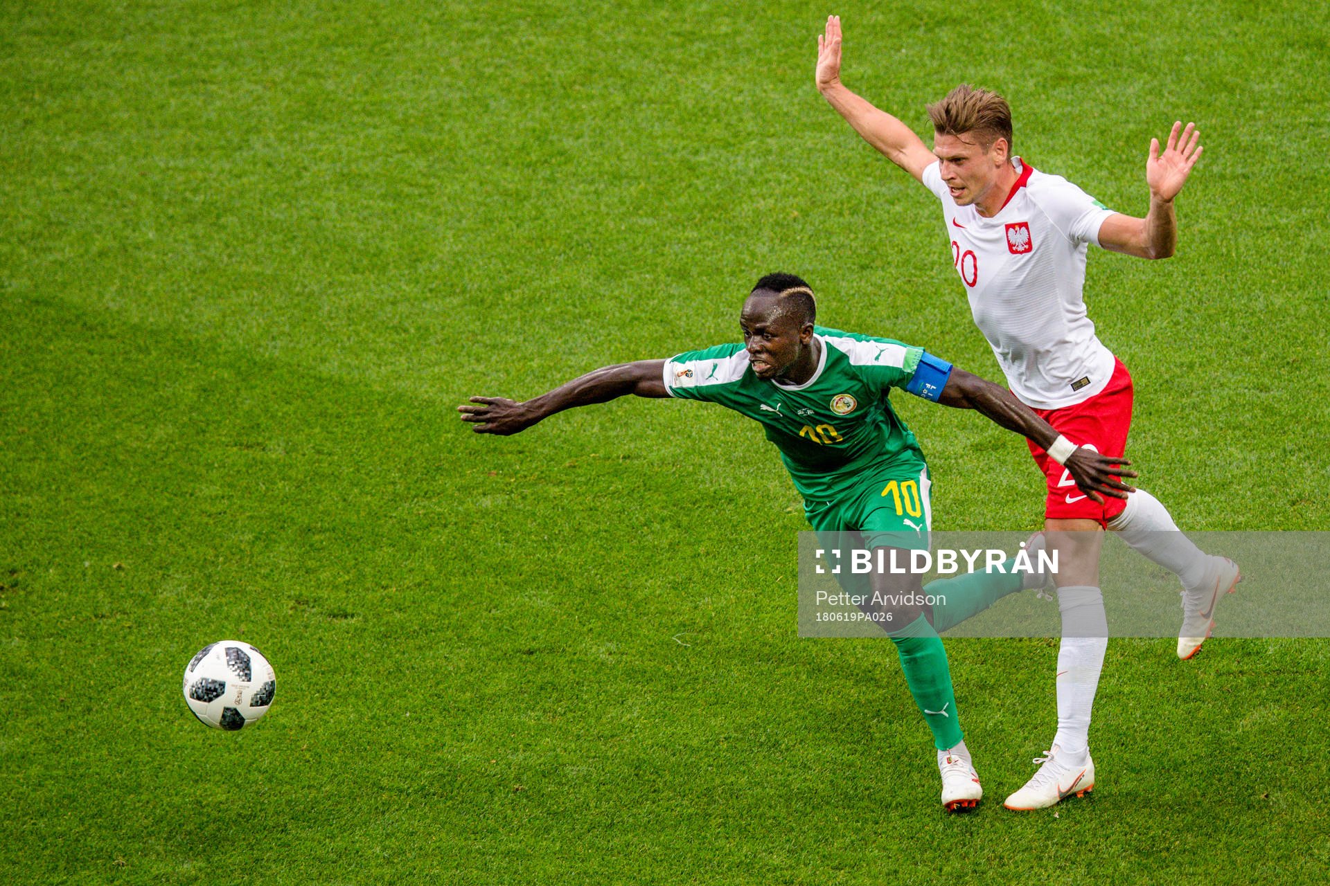 Sadio Mane of Senegal and Lukasz Piszczek of Poland
