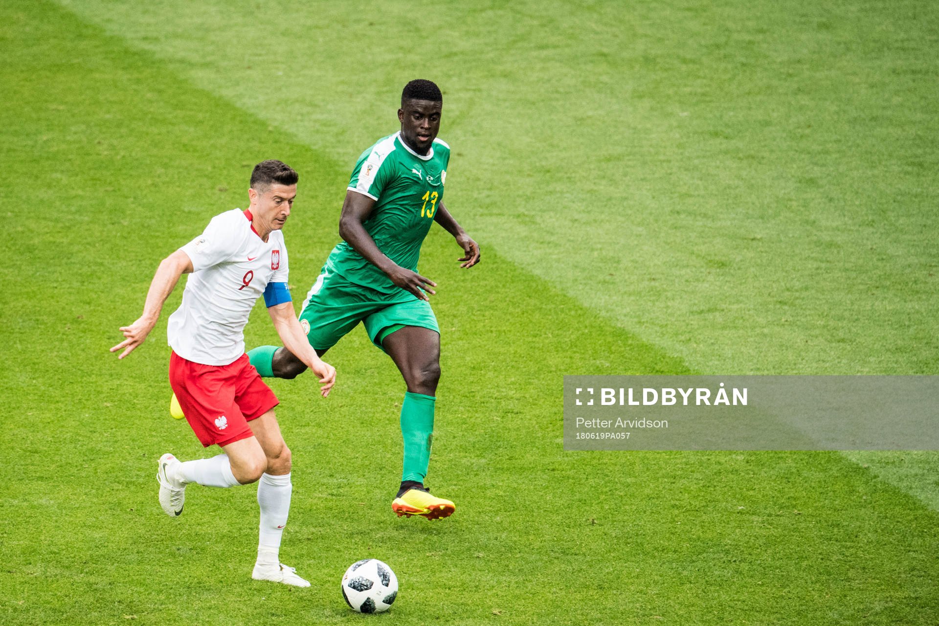Robert Lewandowski of Poland and Alfred Ndiaye of Senegal