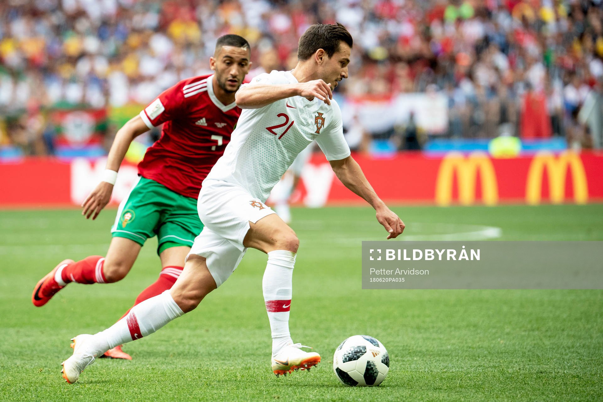 Cedric of Portugal and Hakim Ziyach of Morocco during the FIFA World Cup group stage match between Portugal and Morocco on June 20, 2018 in Moscow.