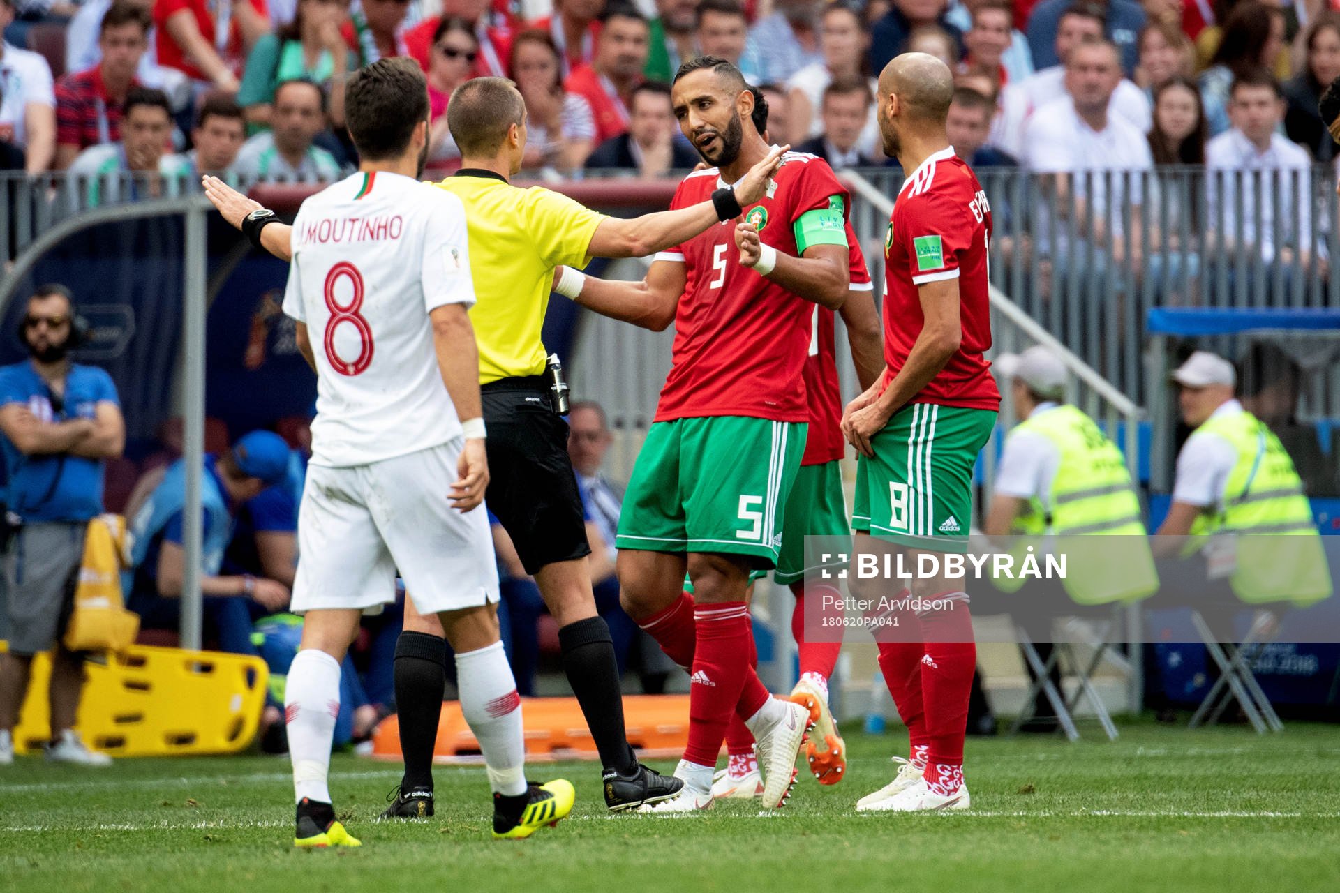 referee Mark Geiger talks to Mehdi Benatia of Morocco during the FIFA World Cup group stage match between Portugal and Morocco on June 20, 2018 in Moscow.