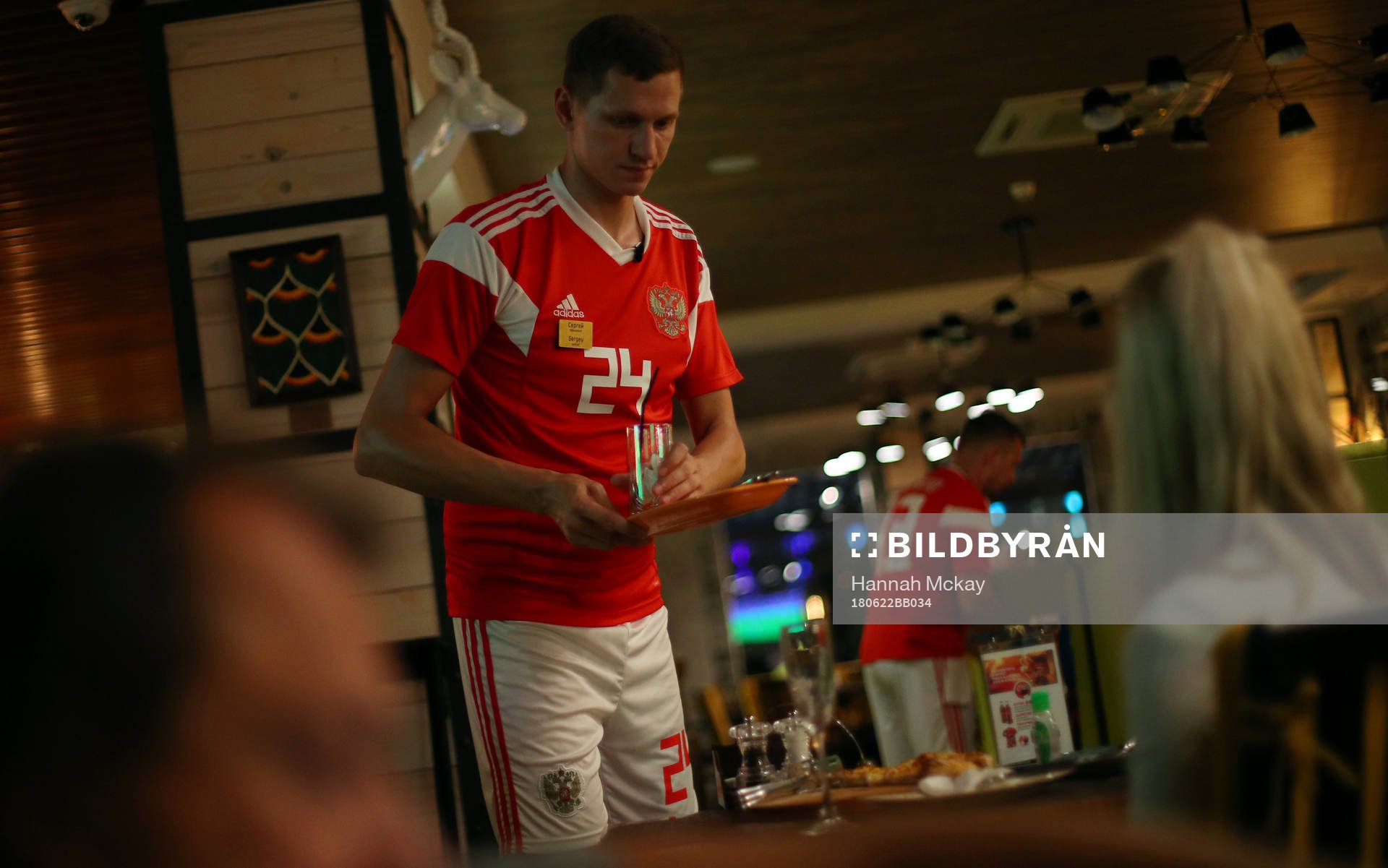 Fotboll, VM A waiter wearing a Russia team football kit