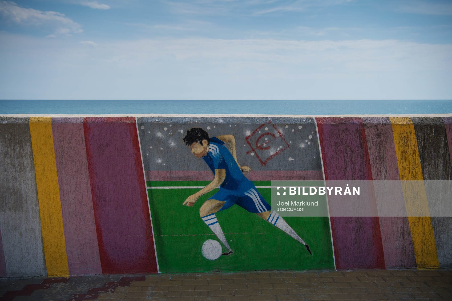A mural with a football player