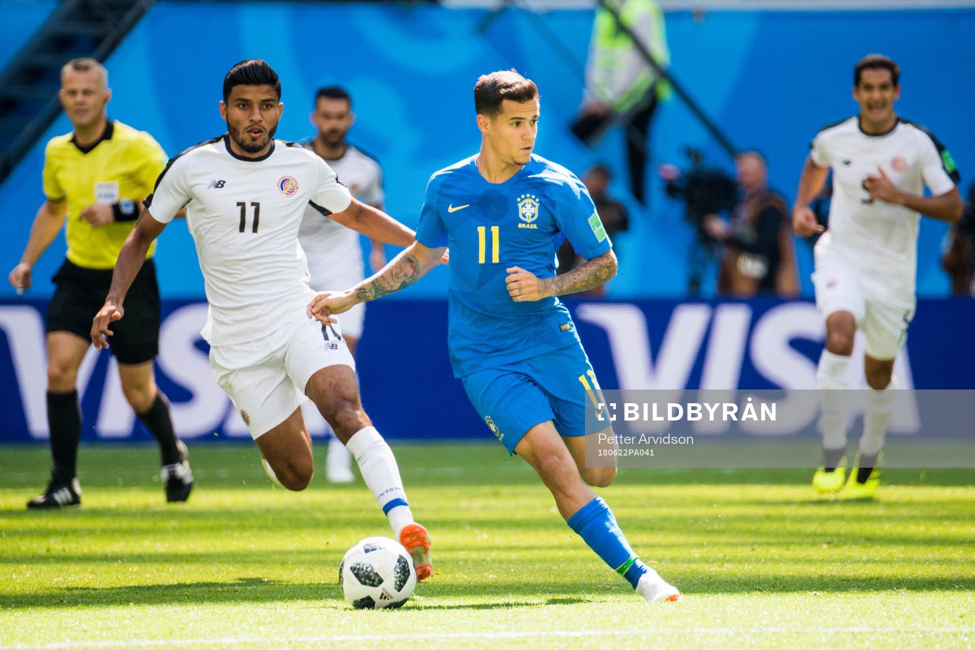 Johan Venegas of Costa Rica and Philippe Coutinho of Brazil