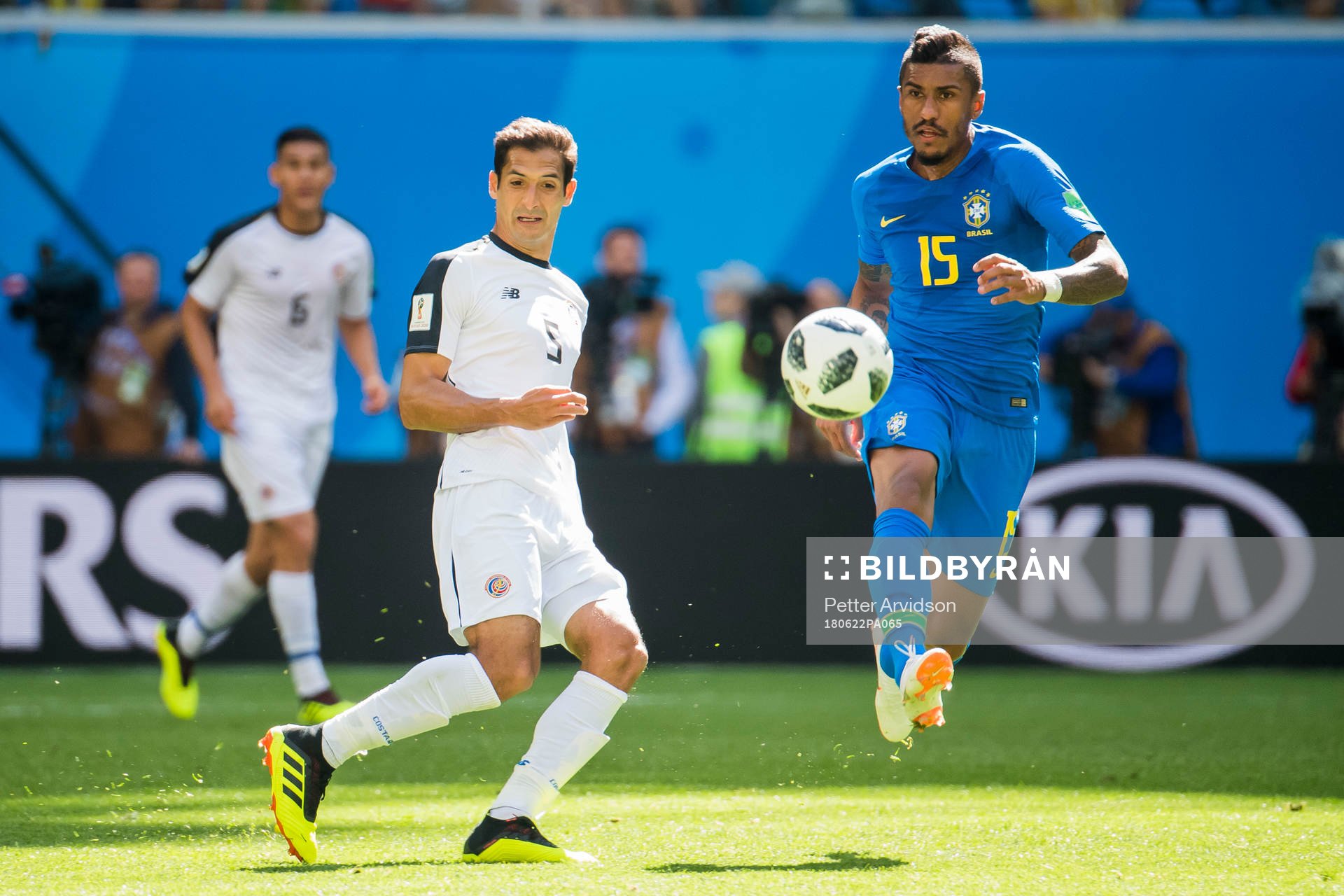 Celso Borges of Costa Rica and Paulinho of Brazil