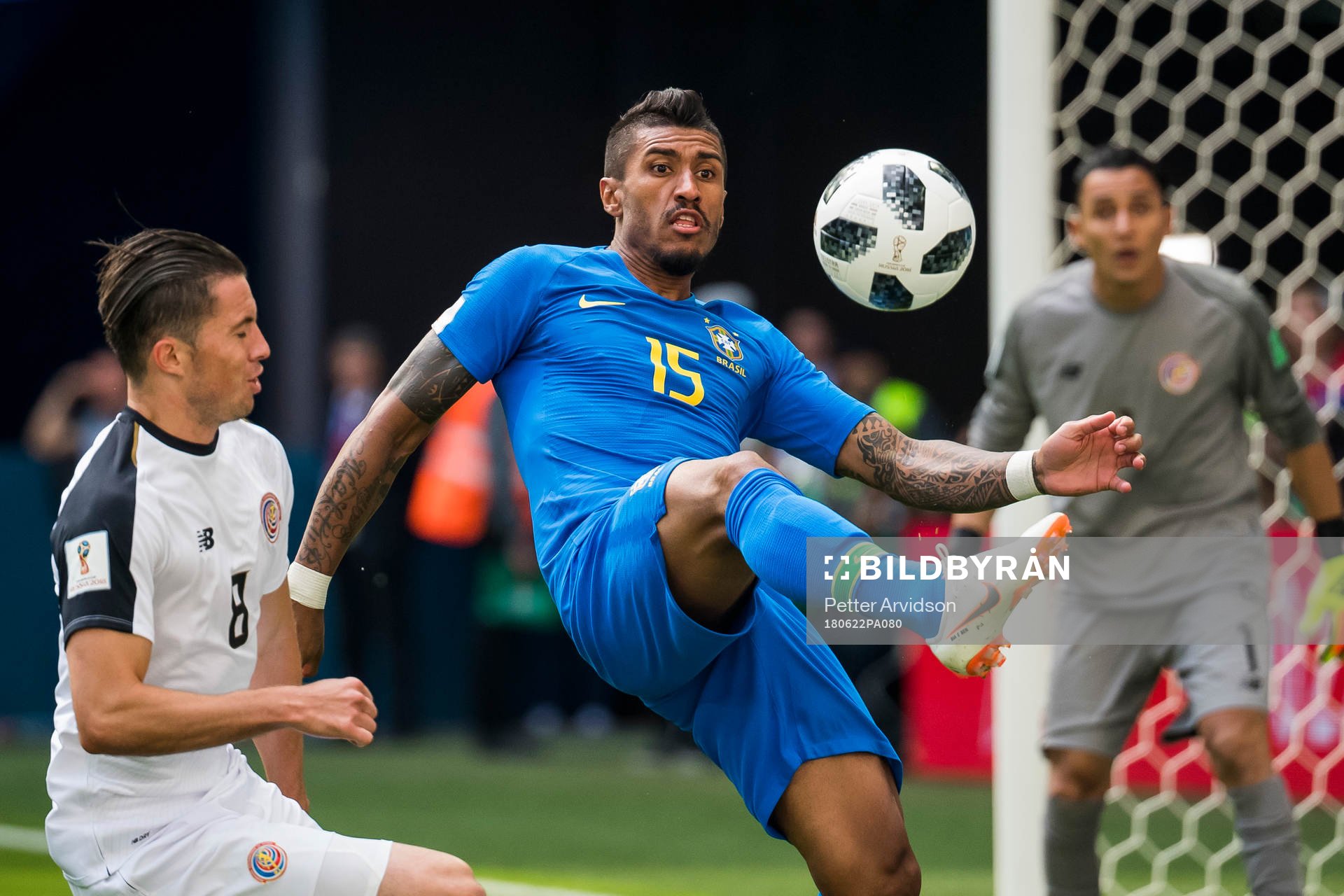 Bryan Oviedo of Costa Rica and Paulinho of Brazil