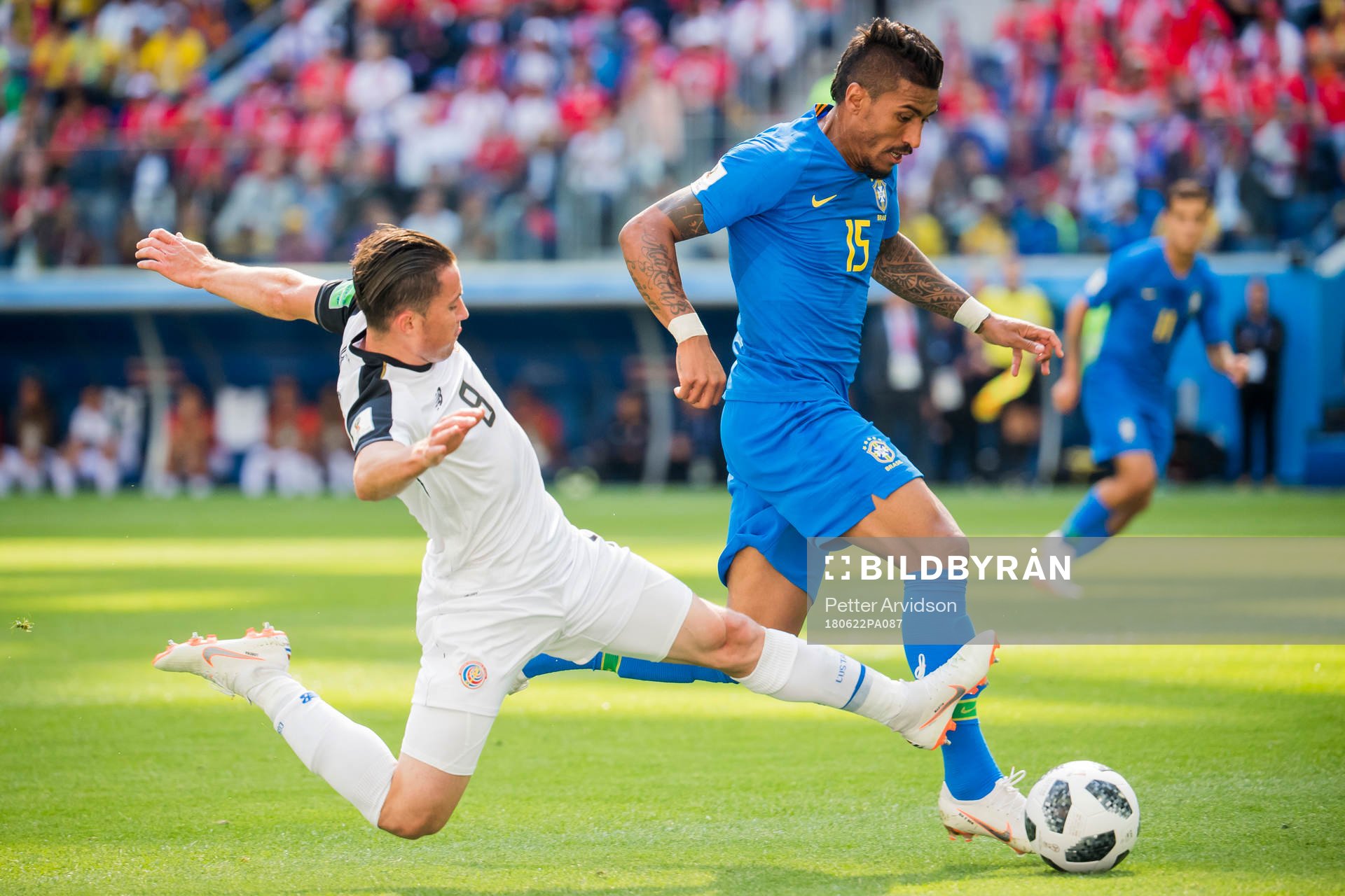 Bryan Oviedo of Costa Rica and Paulinho of Brazil