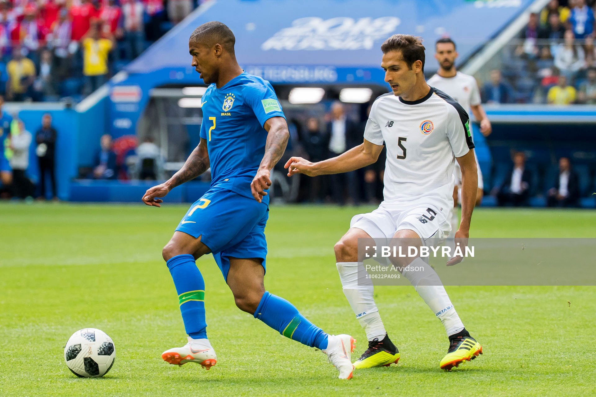 Douglas Costa of Brazil and Celso Borges of Costa Rica