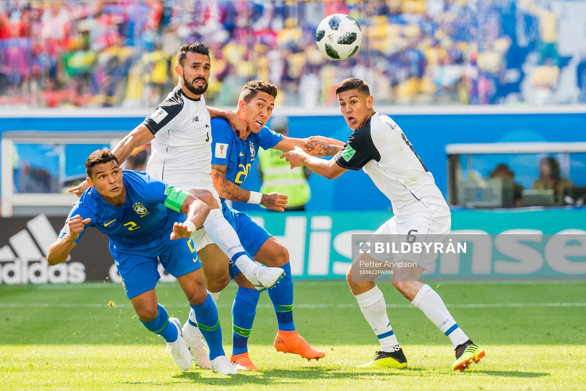 Thiago Silva and Roberto Firmino of Brazil compete for the ball against Giancarlo Gonzalez and Oscar Duarte of Costa Rica during the FIFA World Cup group stage match between Brazil and Costa Rica on June 22, 2018 in Sankt Petersburg.
