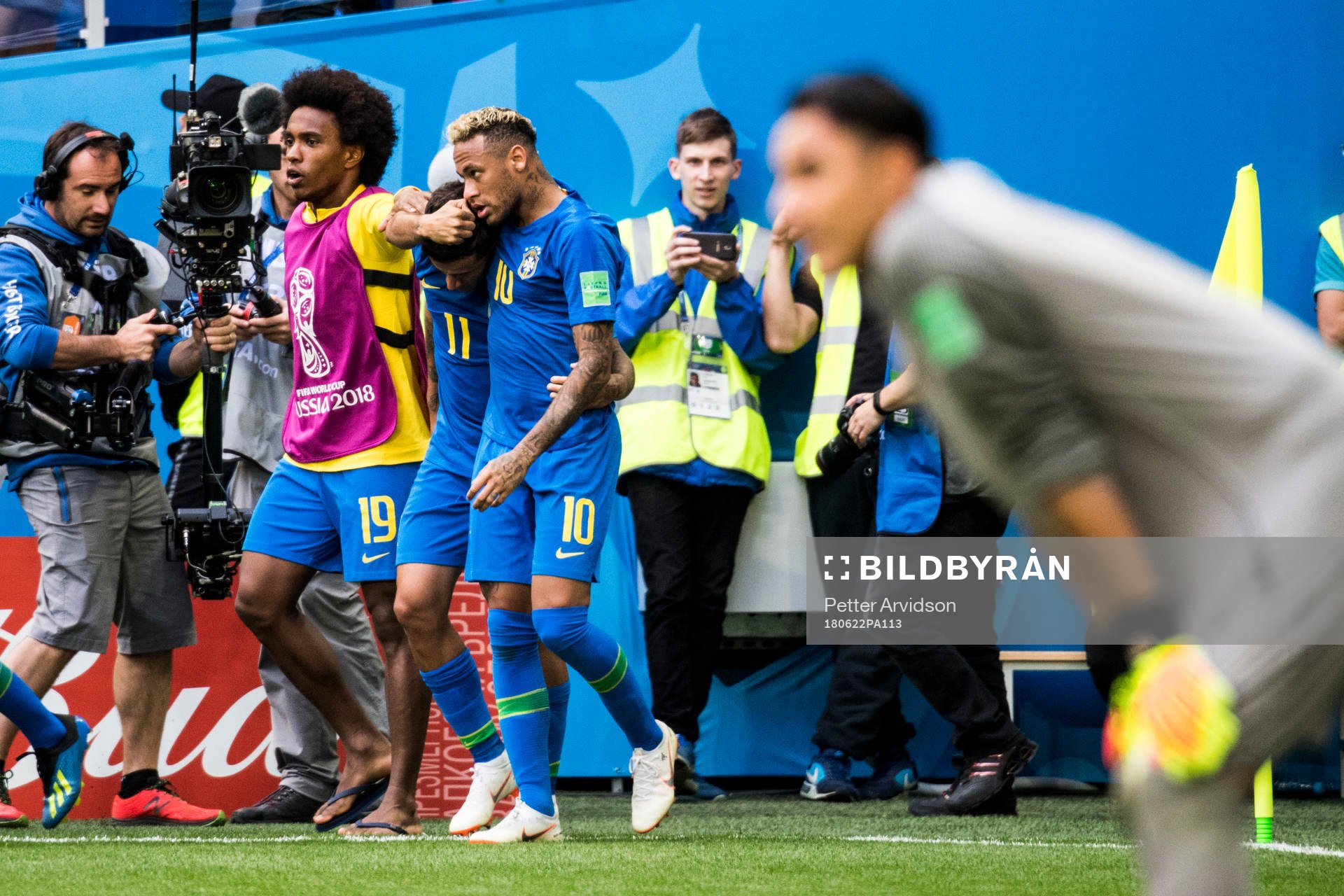 Philippe Coutinho of Brazil celebrates with his teammates
