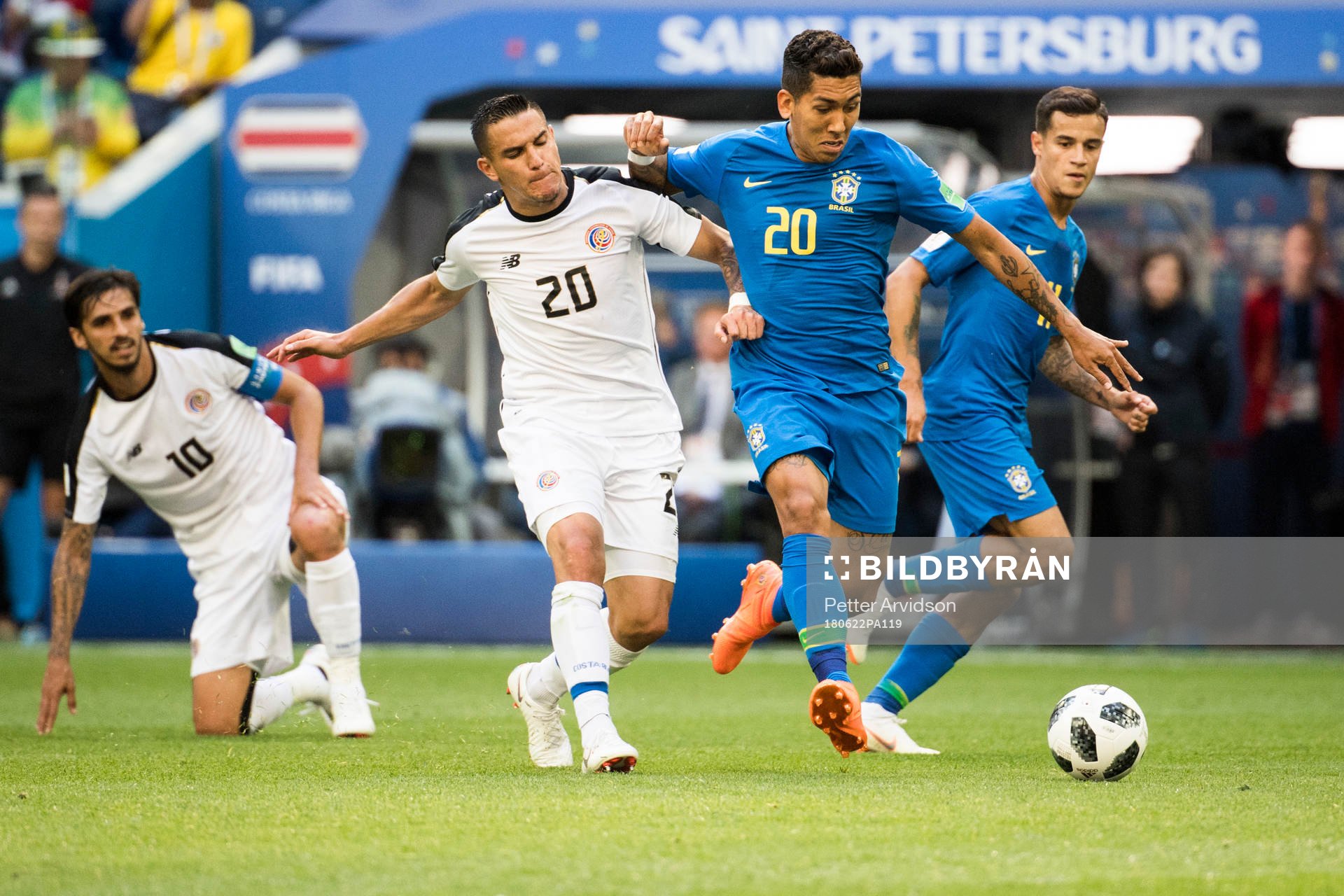 David Guzman of Costa Rica and Roberto Firmino of Brazil