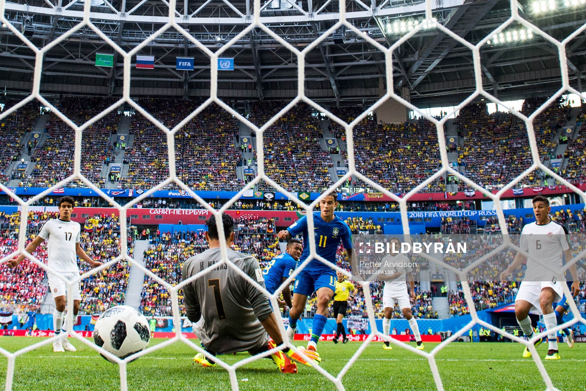 Philippe Coutinho of Brazil scores 1-0 behind goalkeeper