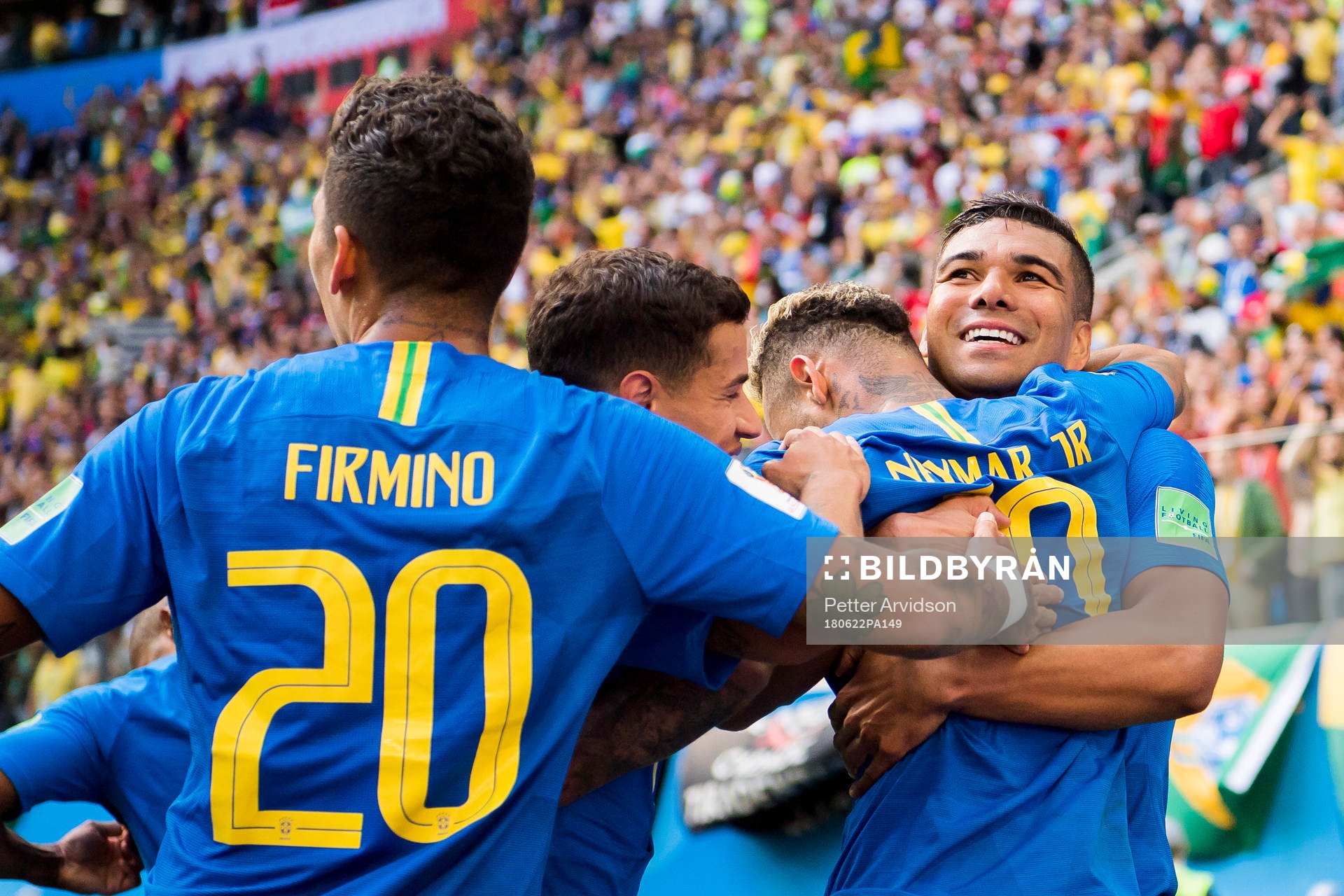 Neymar of Brazil celebrates with his teammates