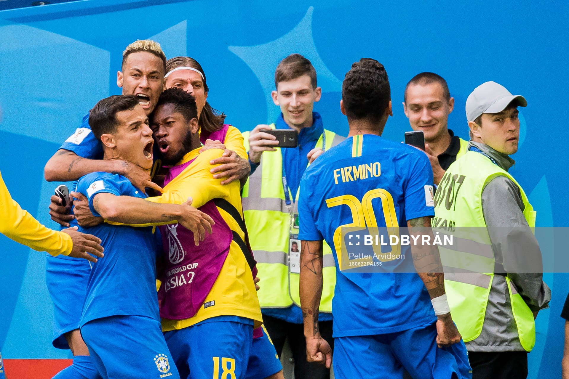 Philippe Coutinho of Brazil celebrates with his teammates
