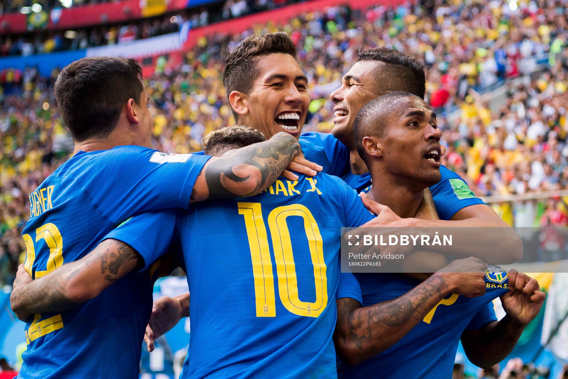 Neymar of Brazil celebrates with his teammates