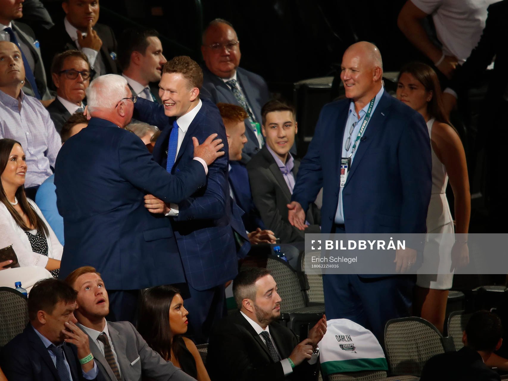 Brady Tkachuk hugs family members