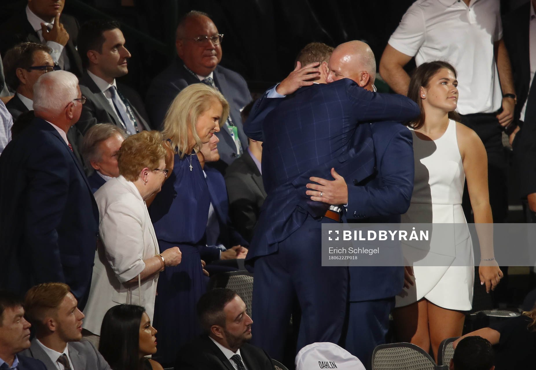 Brady Tkachuk hugs his father and U.S. Hockey Hall of Fame