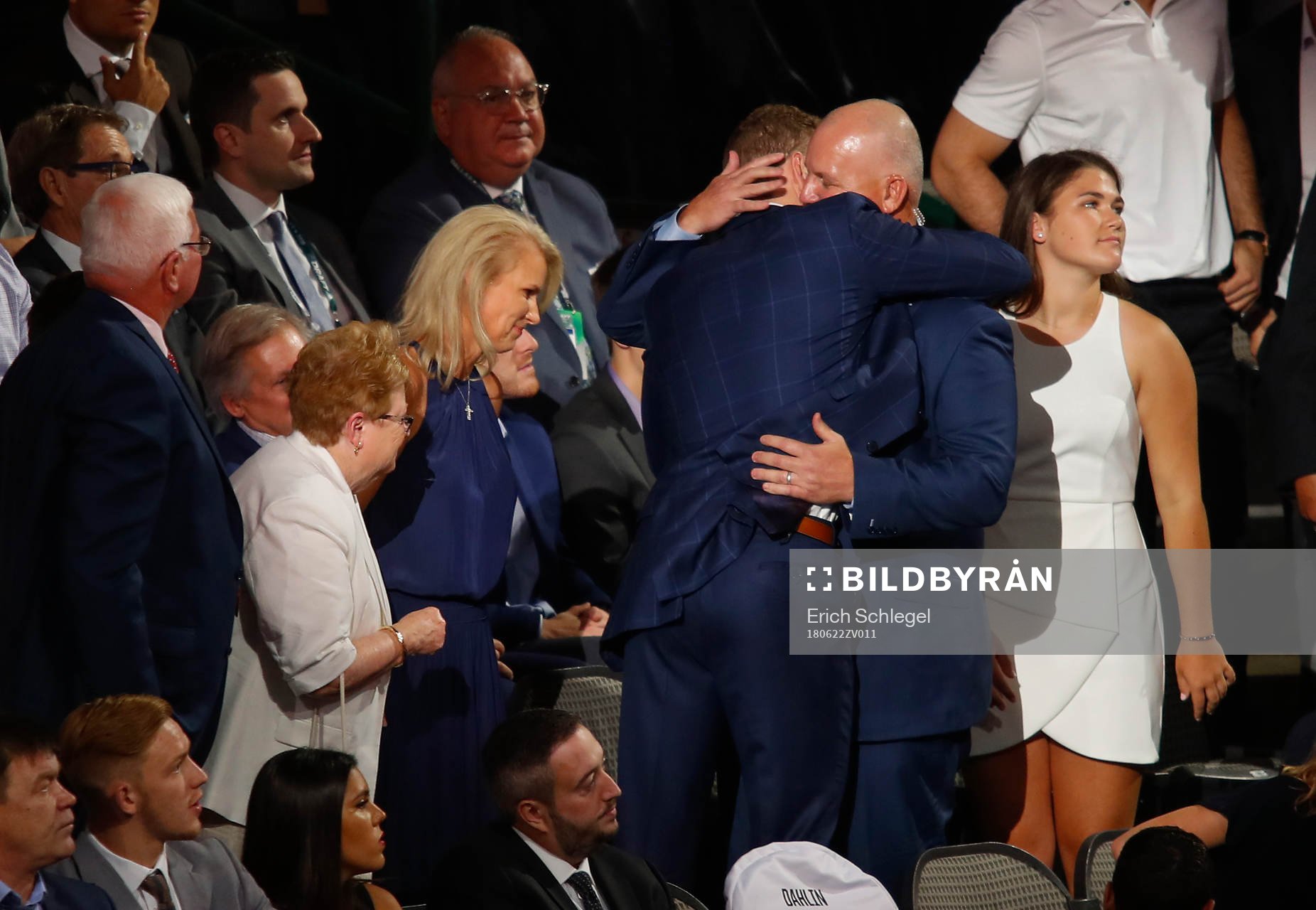 Brady Tkachuk hugs his father and U.S. Hockey Hall of Fame