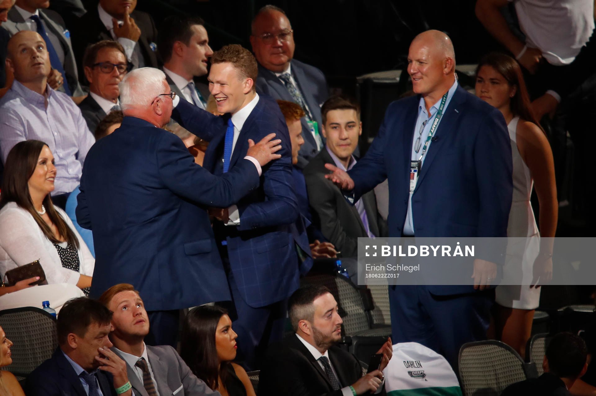 Brady Tkachuk hugs family members