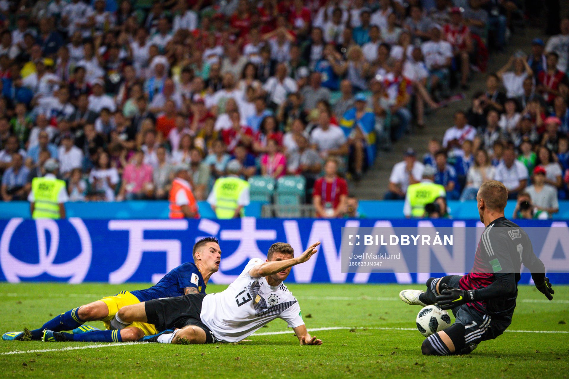Thomas Müller of Germany against Mikael Lustig and