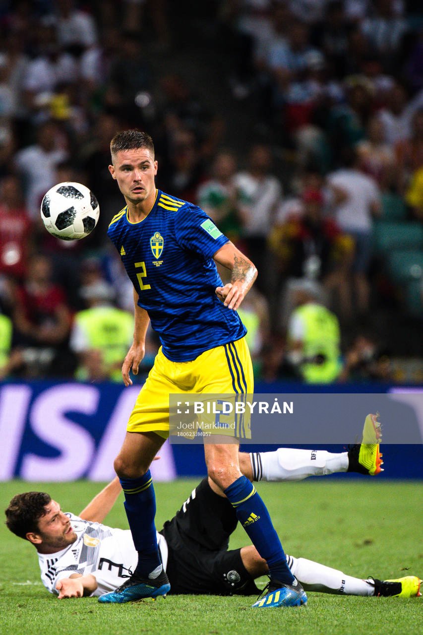 Jonas Hector of Germany and Mikael Lustig of Sweden