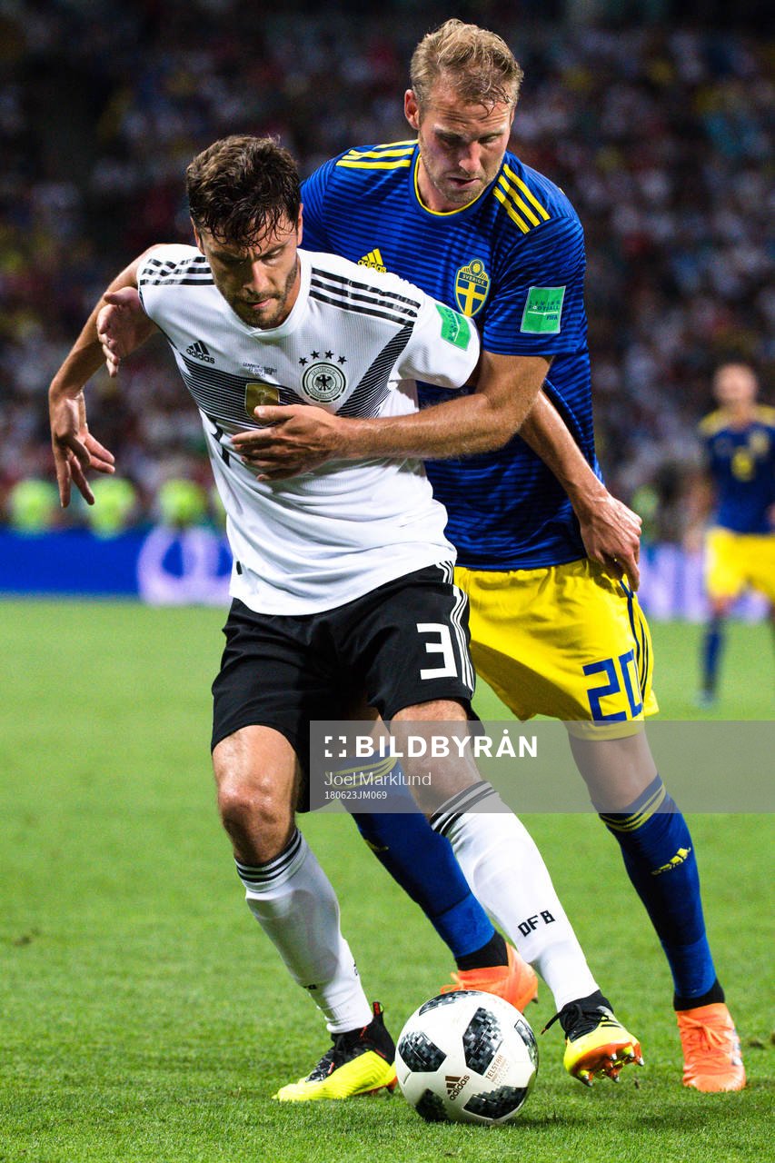 Jonas Hector of Germany and Ola Toivonen of Sweden