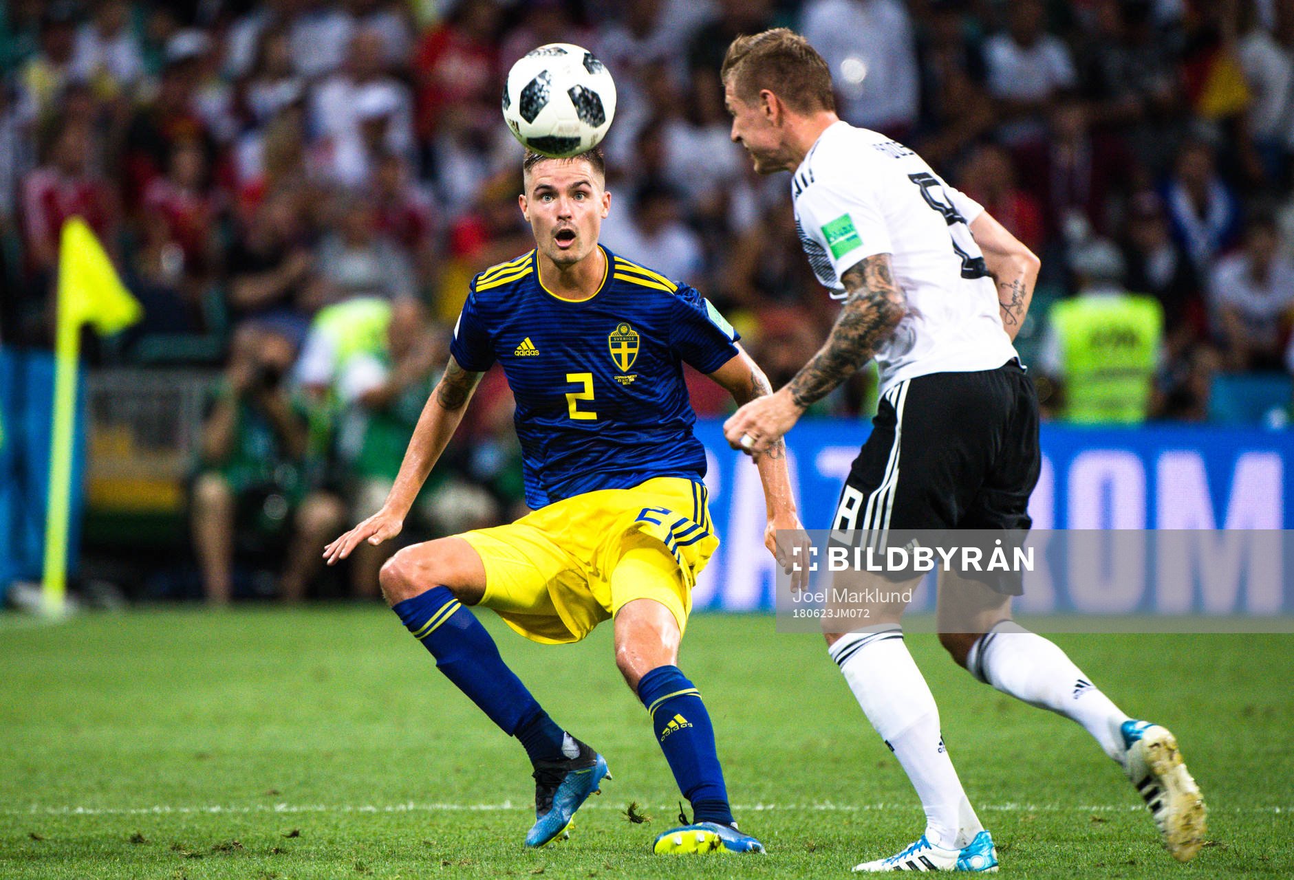 Mikael Lustig of Sweden and  Toni Kroos  of Germany