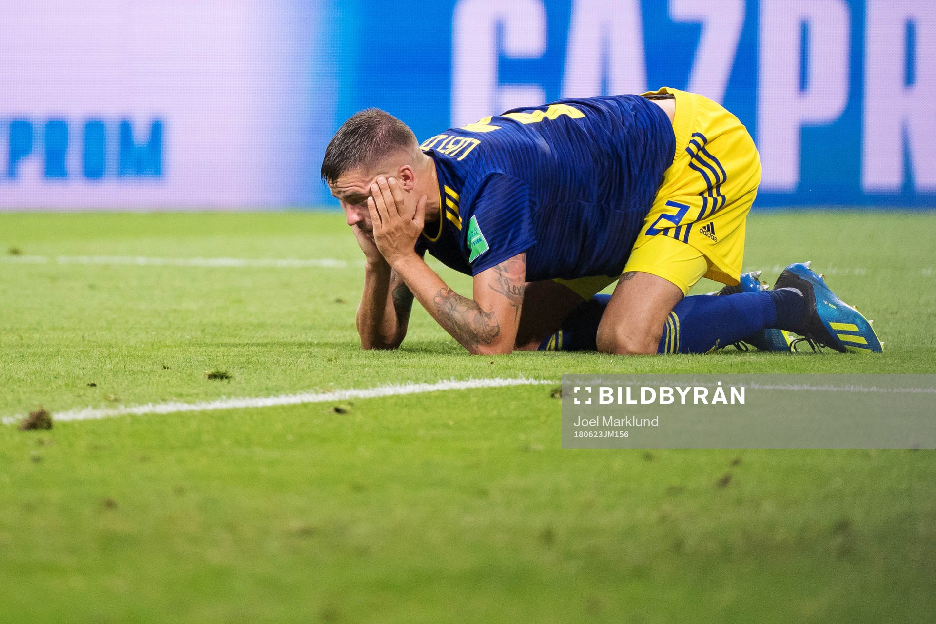Mikael Lustig of Sweden look dejected