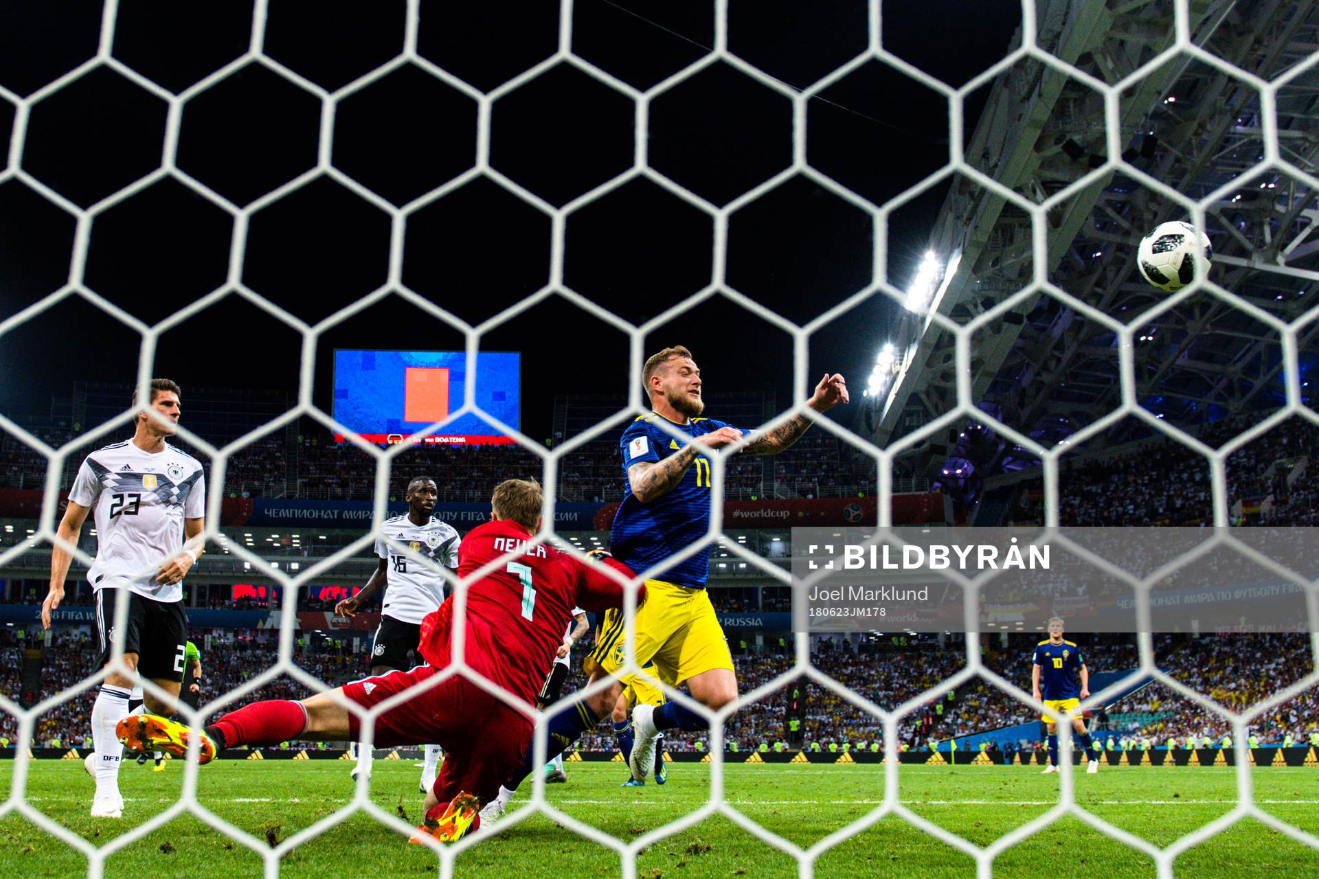 John Guidetti of Sweden against goalkeeper Manuel Neuer of