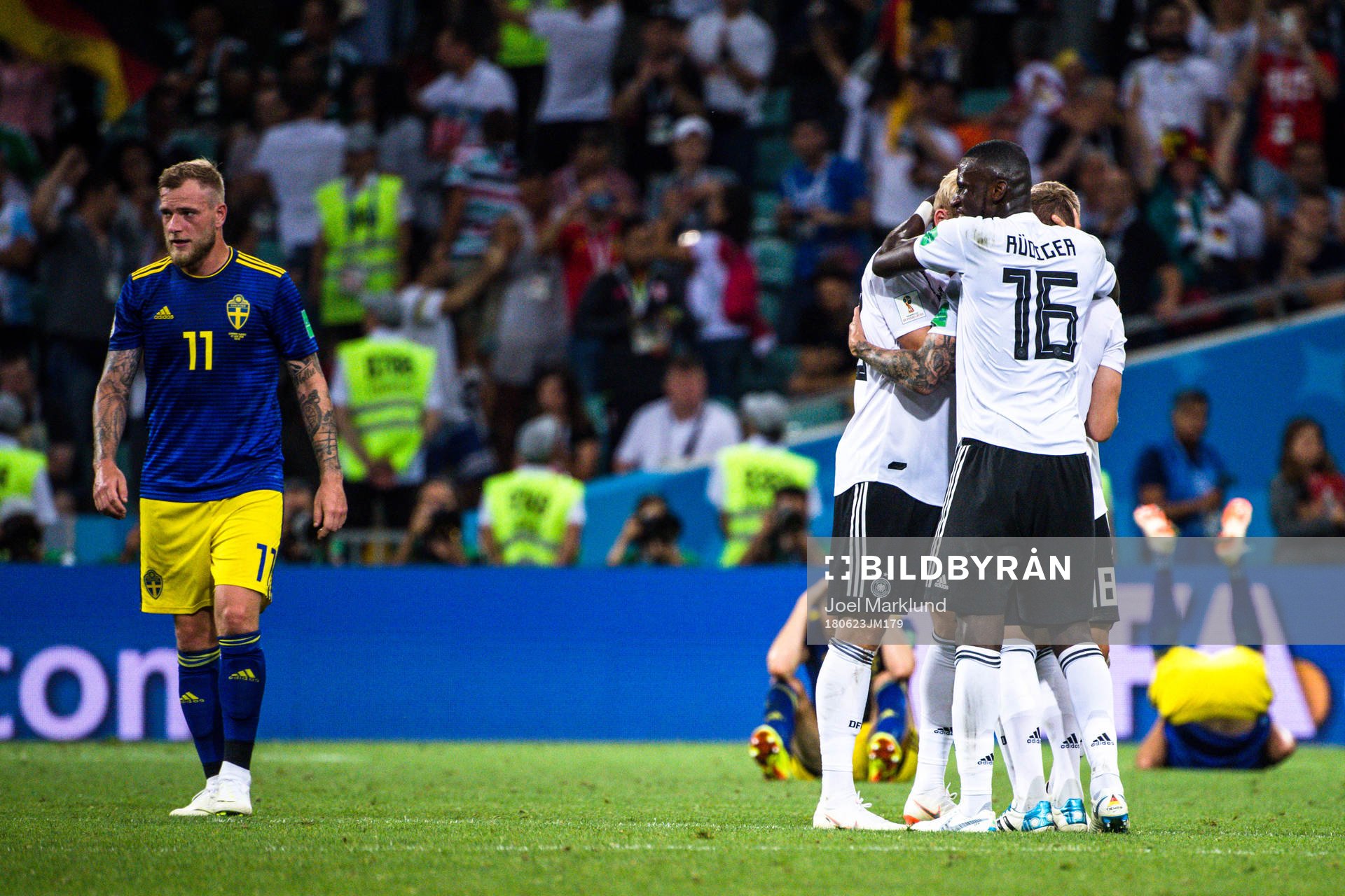 John Guidetti of Sweden looks dejected while Antonio