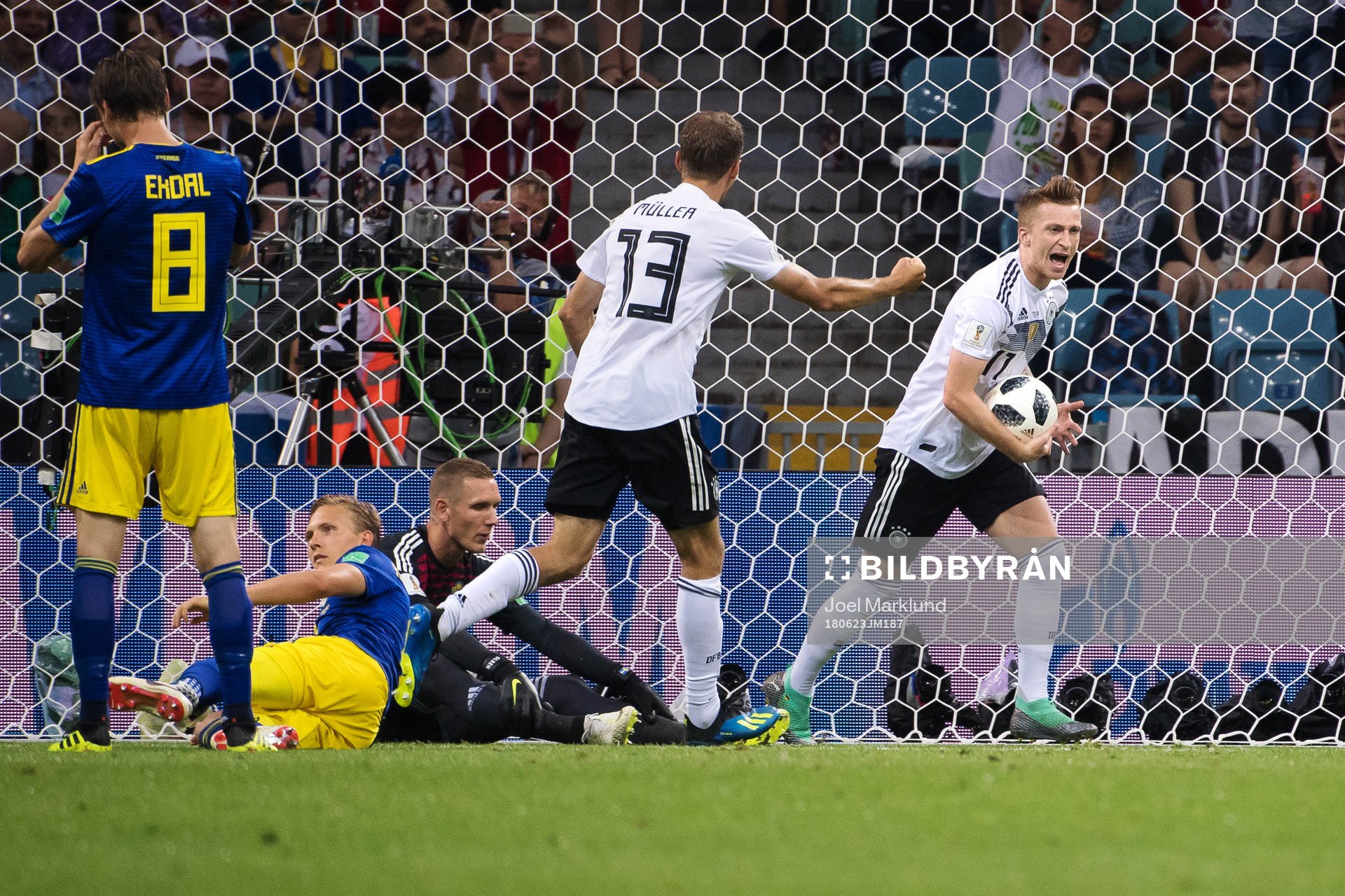 Thomas Müller and Marco Reus of Germany celebrates