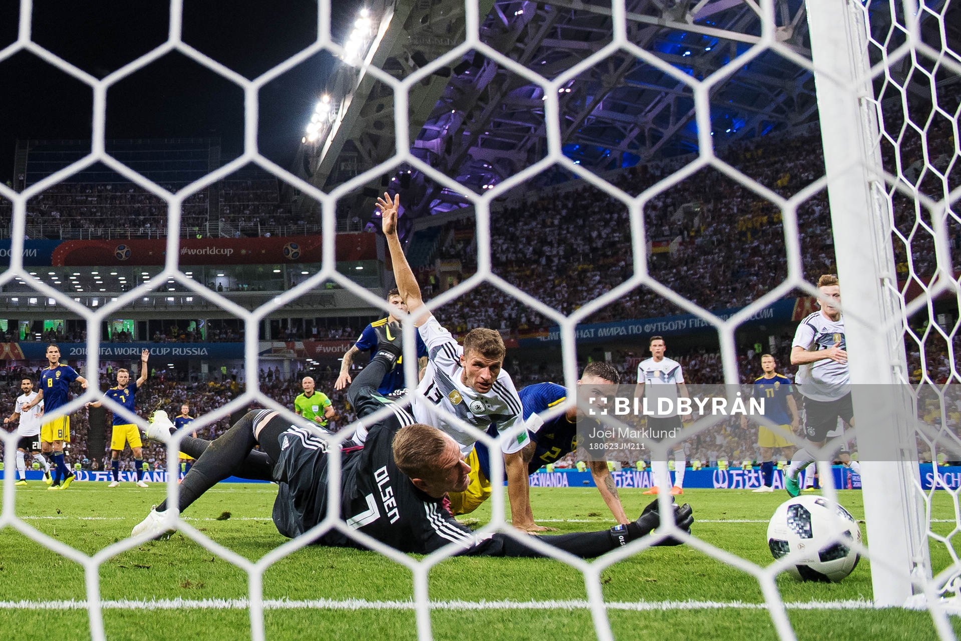 Goalkeeper Robin Olsen of Sweden makes a save from Thomas