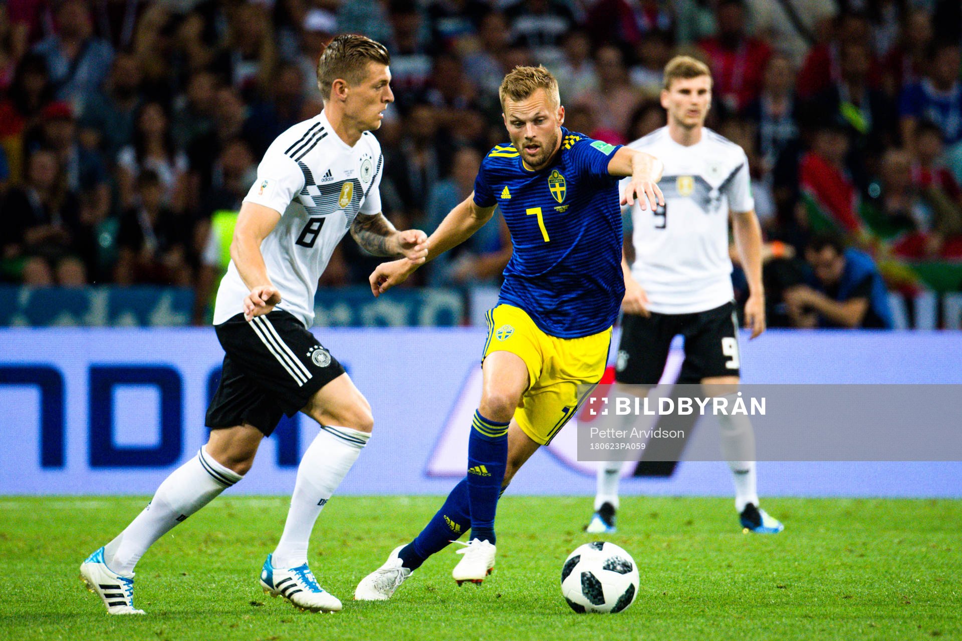 Sebastian Larsson of Sweden and Toni Kroos of Germany