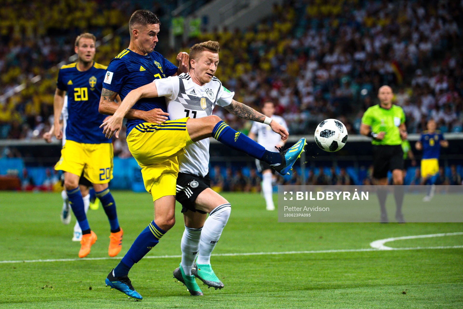 Mikael Lustig of Sweden and Marco Reus of Germany