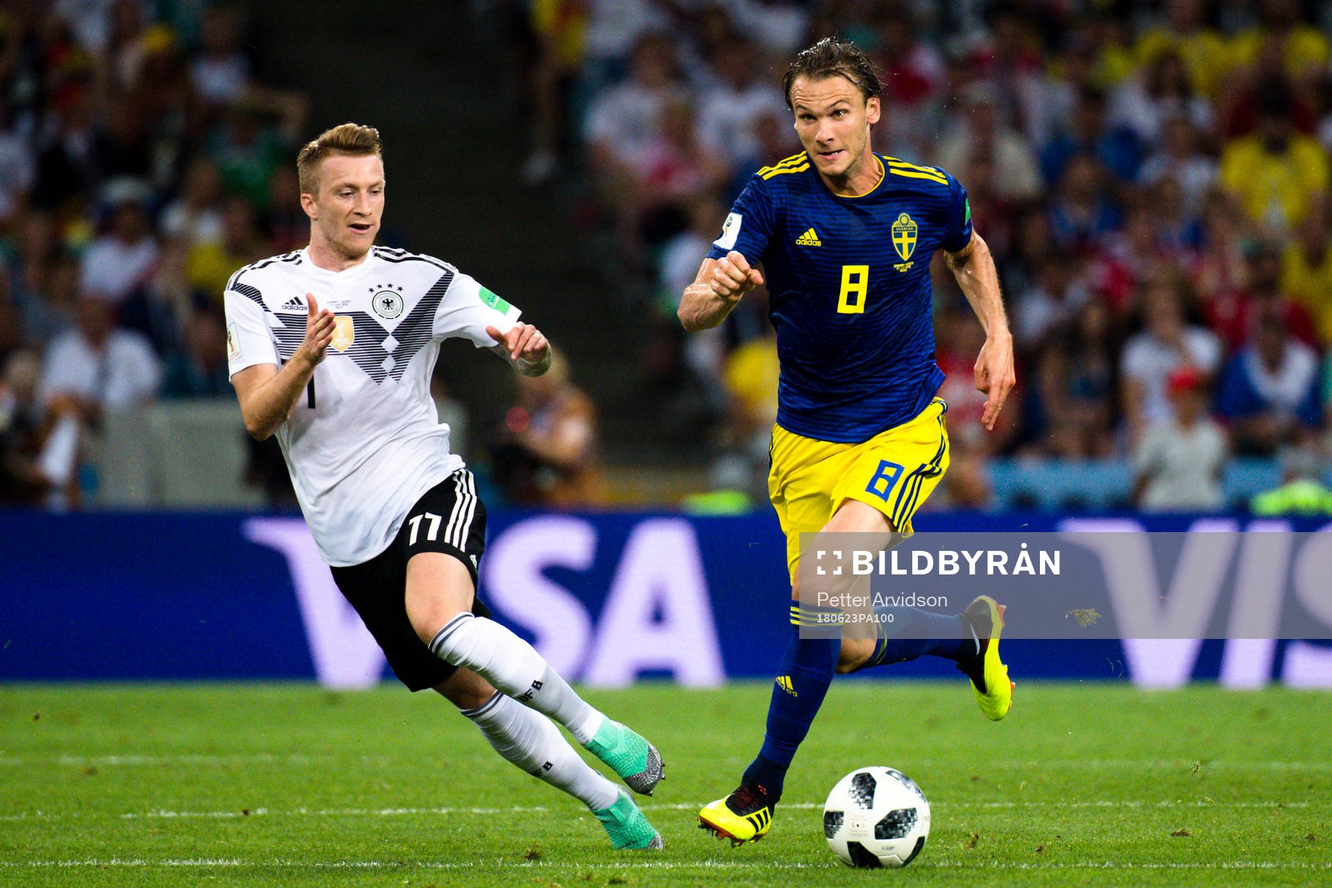 Marco Reus  of Germany and Albin Ekdal of Sweden
