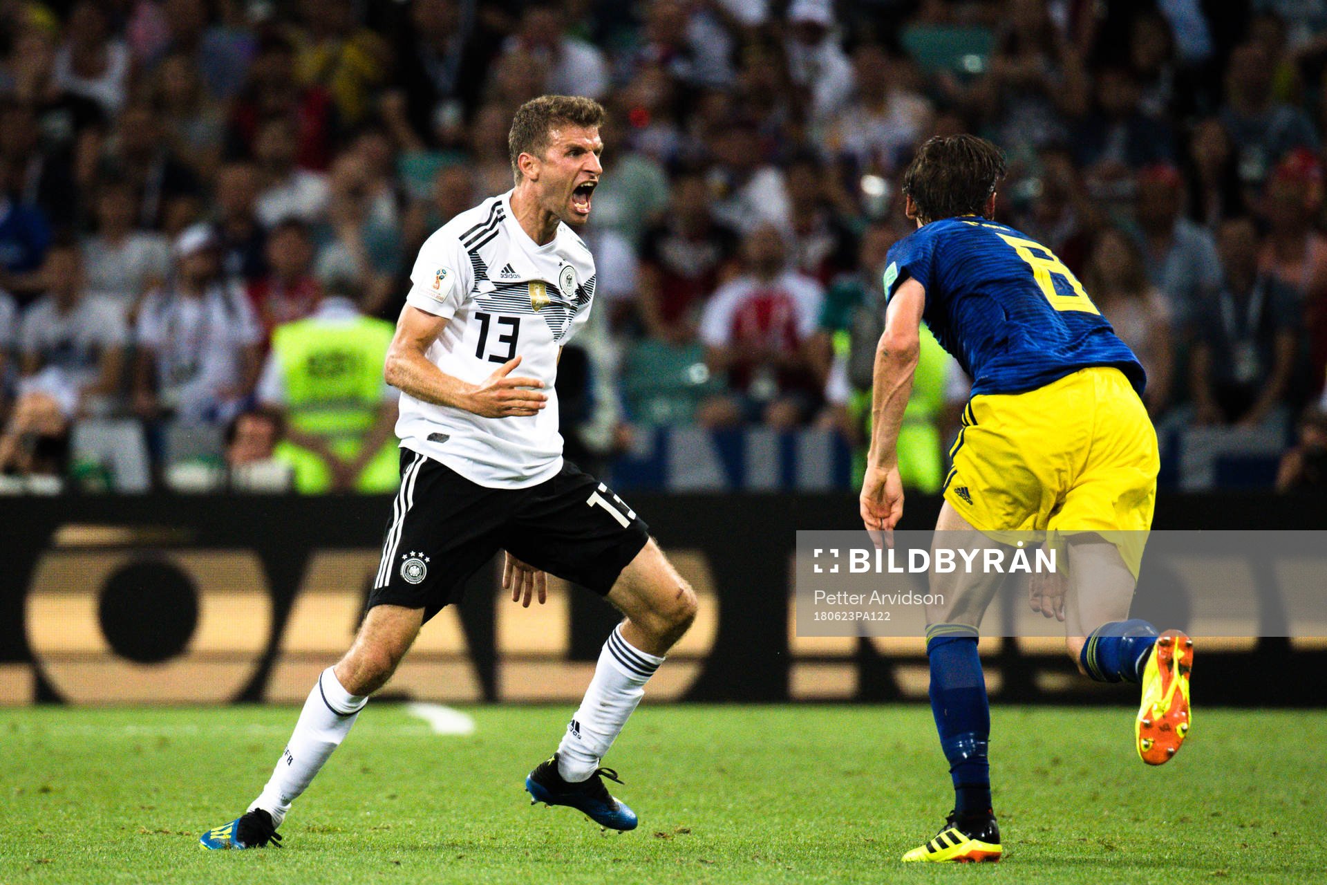 Thomas Müller of Germany and Albin Ekdal of Sweden