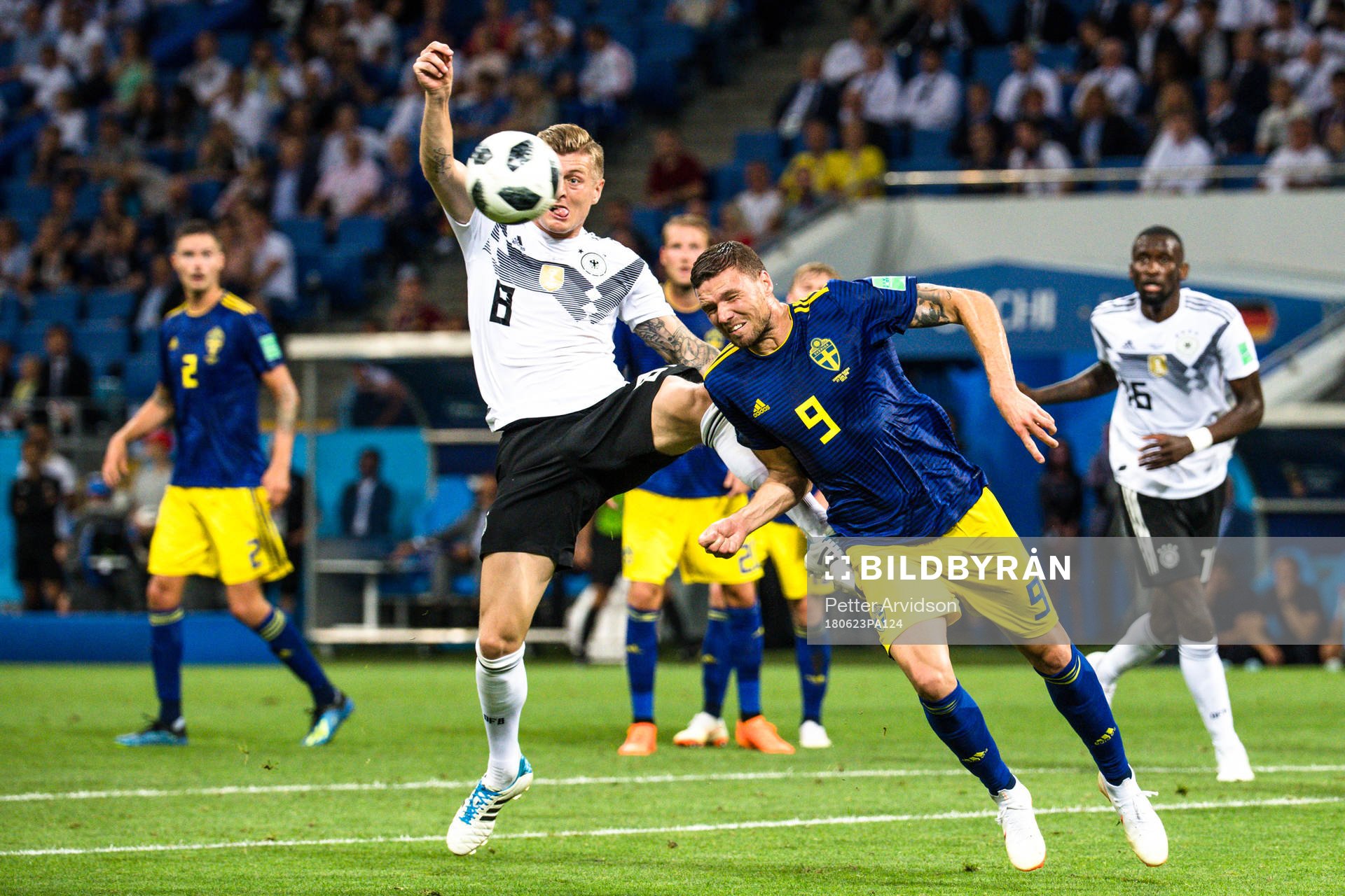 Toni Kroos of Germany and Marcus Berg of Sweden