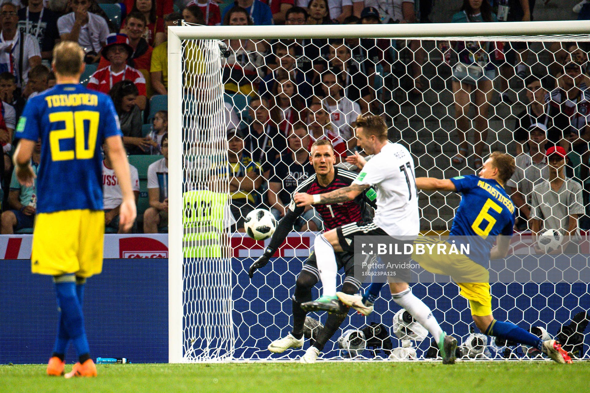Marco Reus of Germany scores the 1-1 goal behind goalkeeper