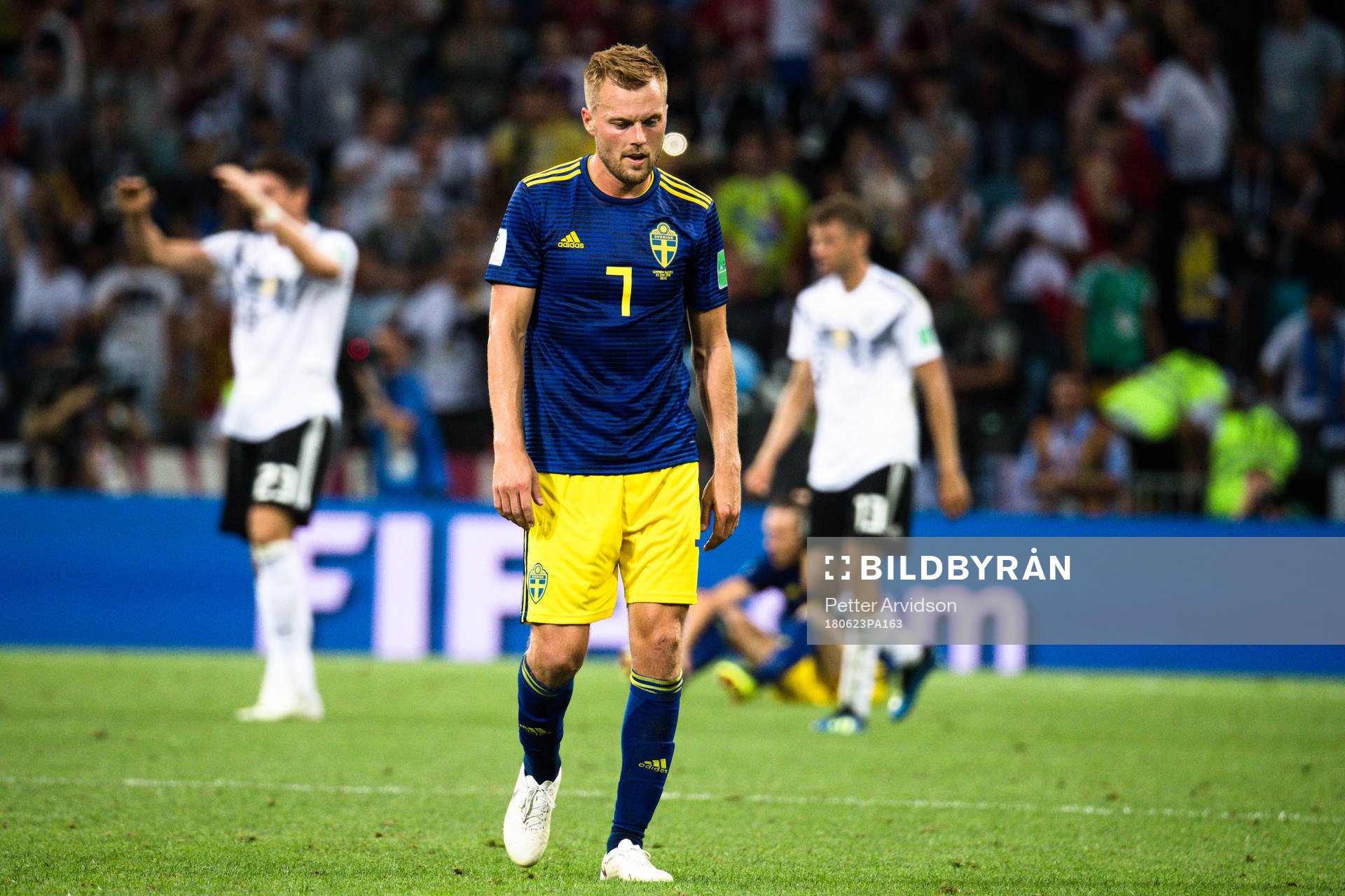 Sebastian Larsson of Swedenlooks dejected