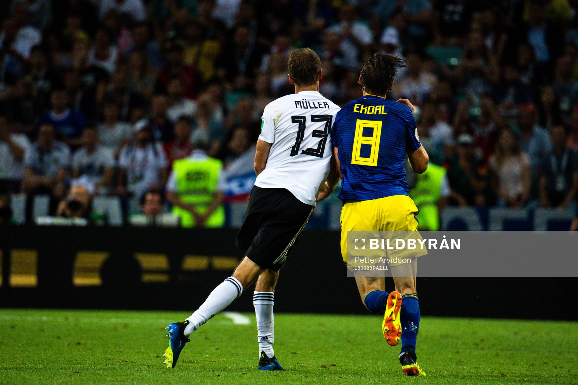 Thomas Müller  of Germany and Albin Ekdal of Sweden