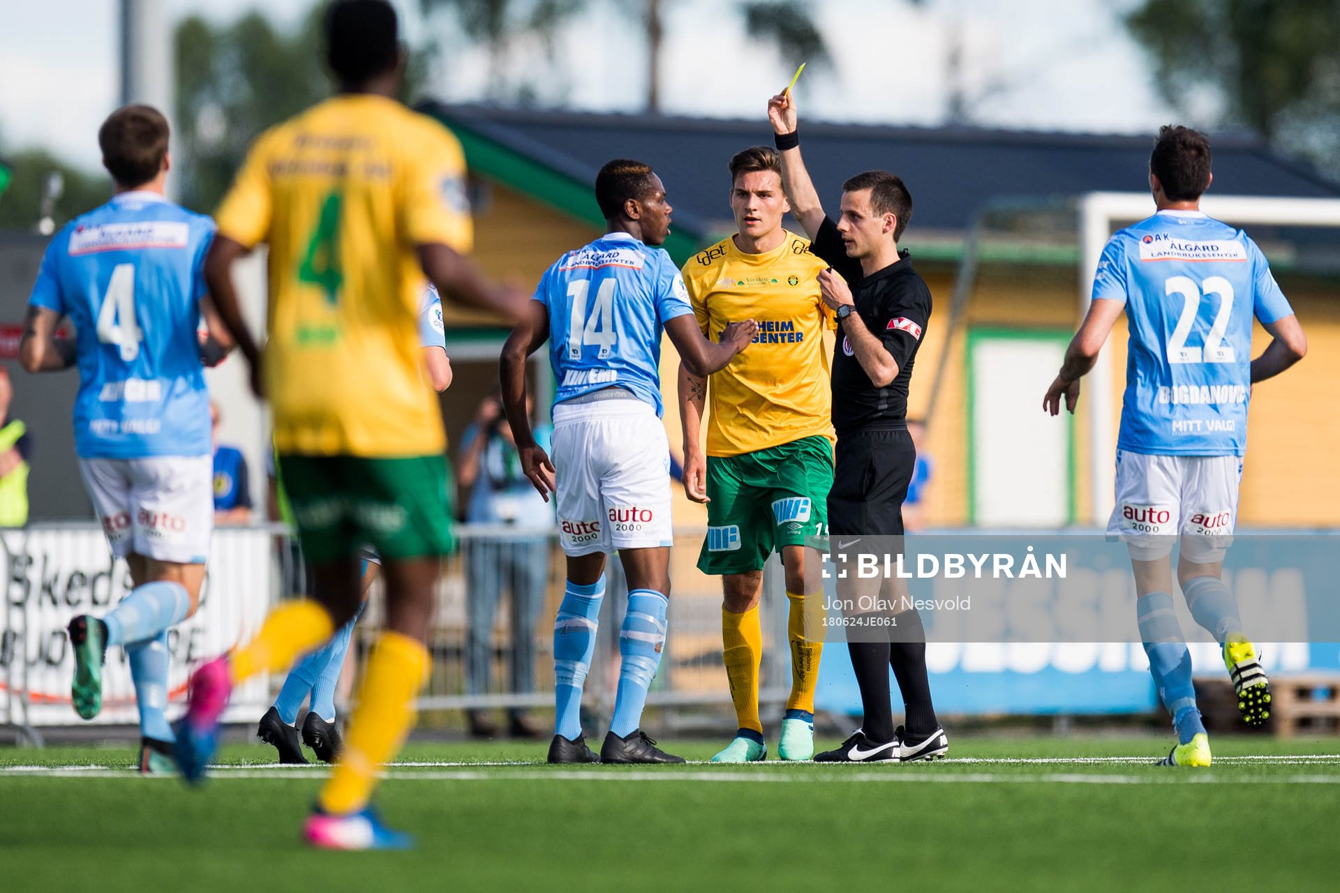 Akinsola Akinyemi of Sandnes Ulf is shown a yellow card by
