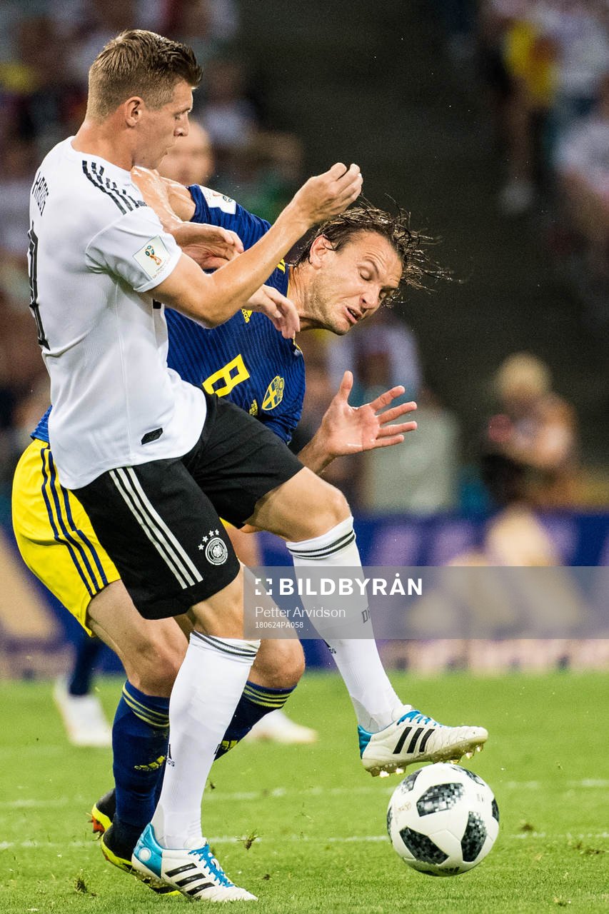Albin Ekdal of Sweden in action with Toni Kroos of Germany