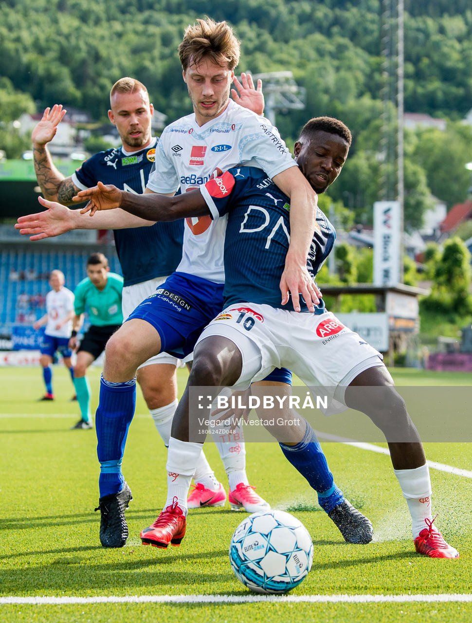 Marcus Pedersen of Strømsgodset, Daniel Kvande of Ranheim and Francisco Júnior of Strømsgodset during the Eliteserien match between Strømsgodset and Ranheim on June 24, 2018 in Drammen.